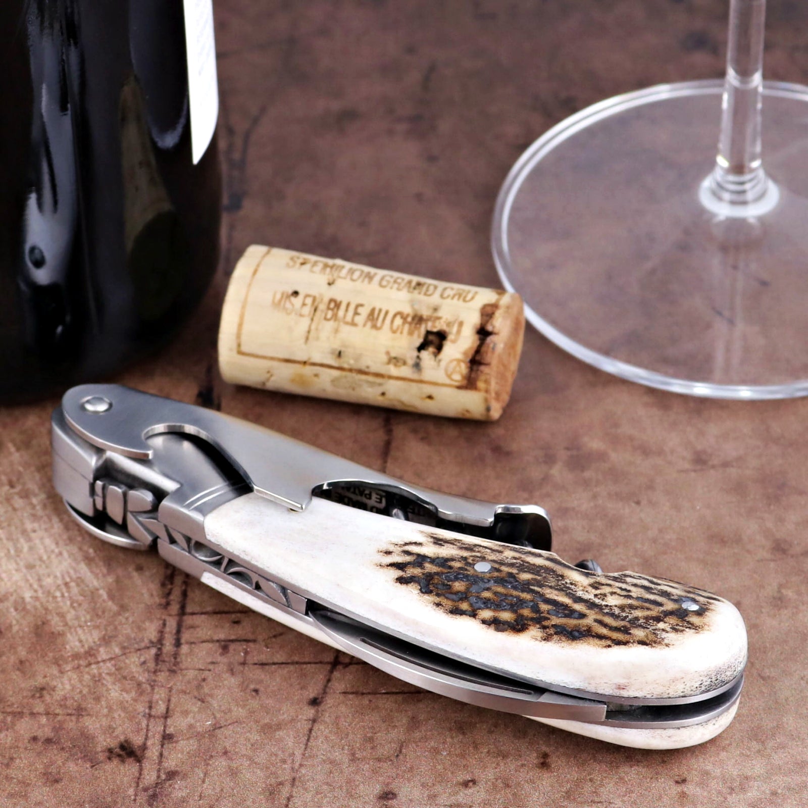 Laguiole Magnum Deer Stag Corkscrew close-up showing textured antler handle and stainless steel tool.