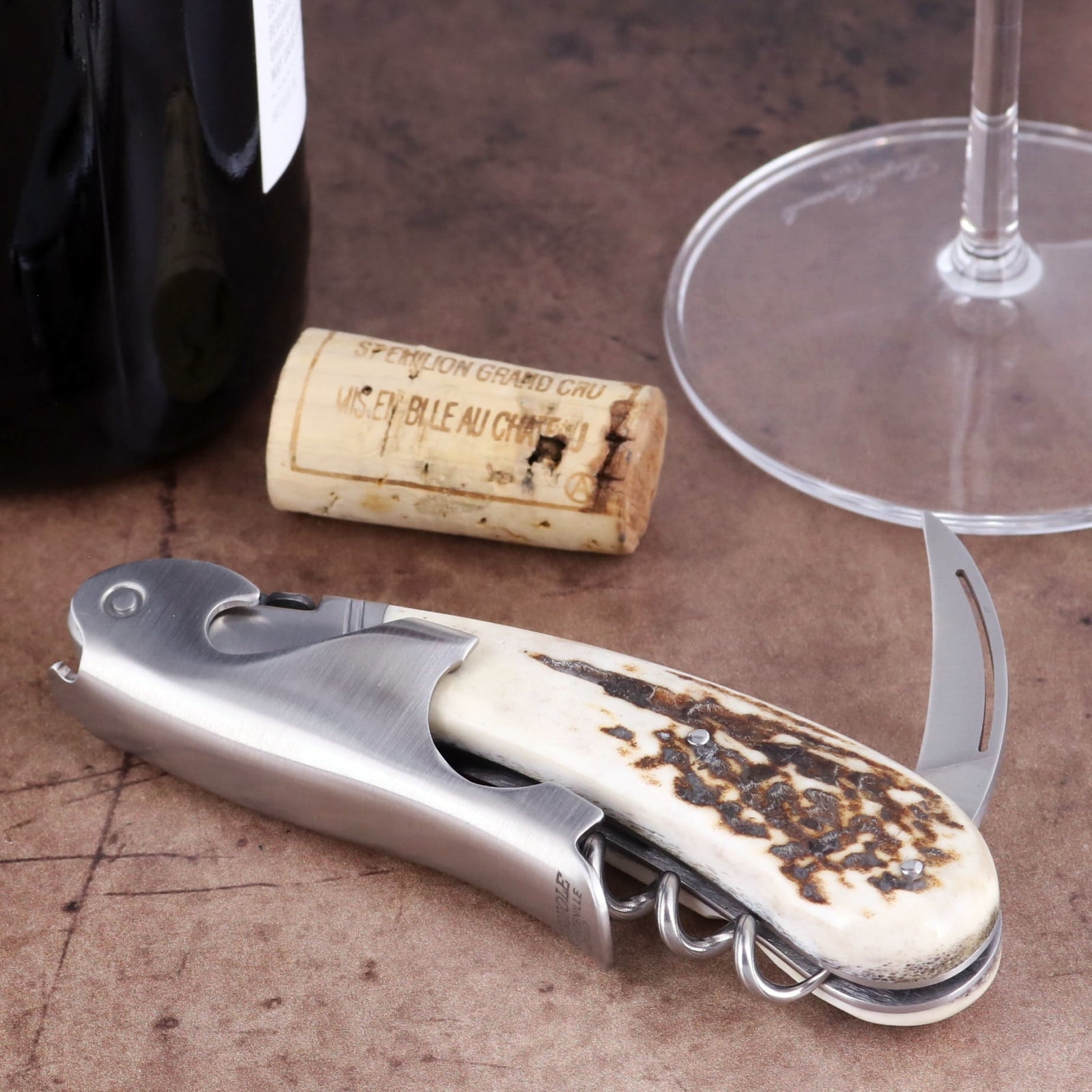 Laguiole Magnum Deer Stag Corkscrew, close-up of stainless steel tool with textured antler handle.