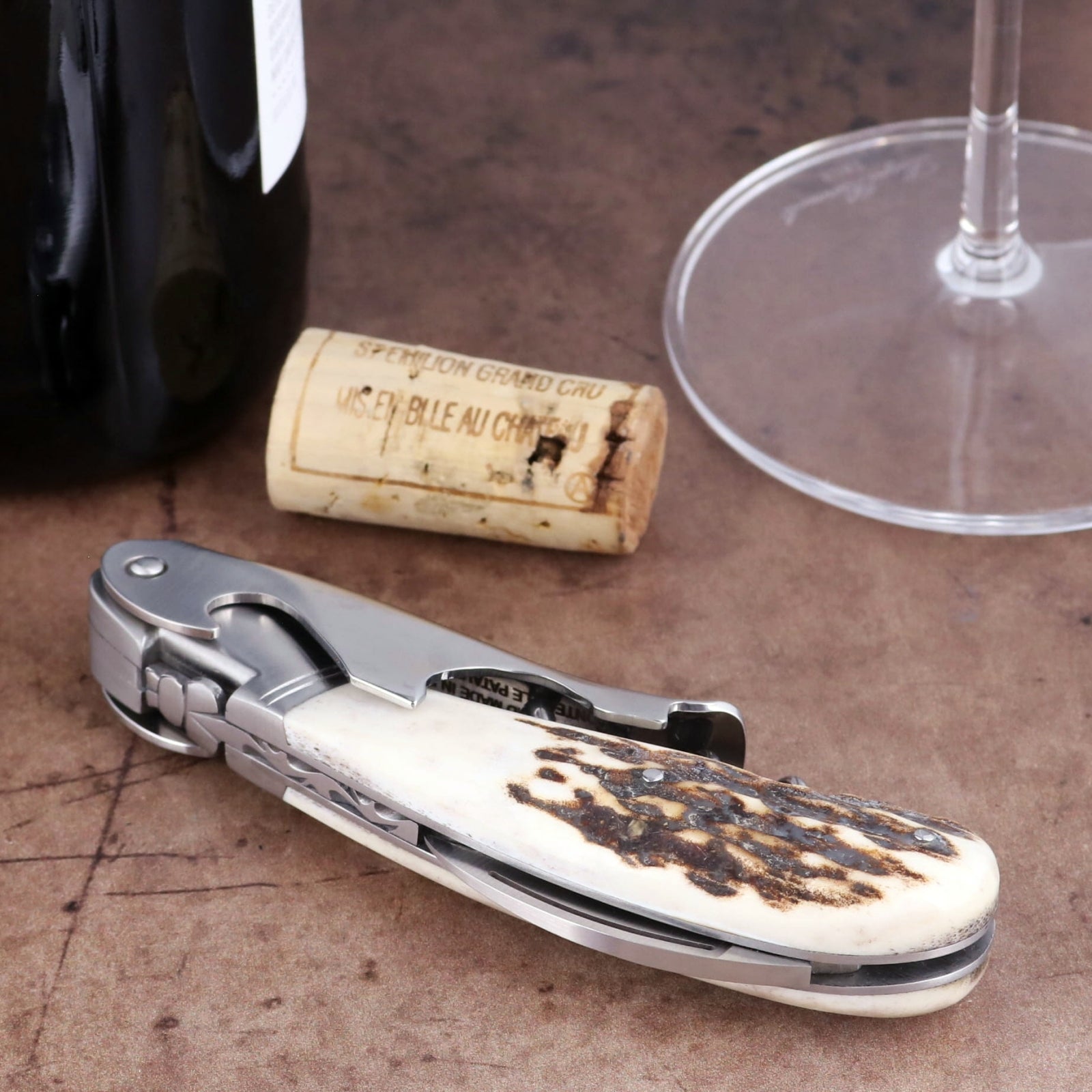 Laguiole Magnum Deer Stag Corkscrew, close-up of stainless steel tool with textured antler handle.