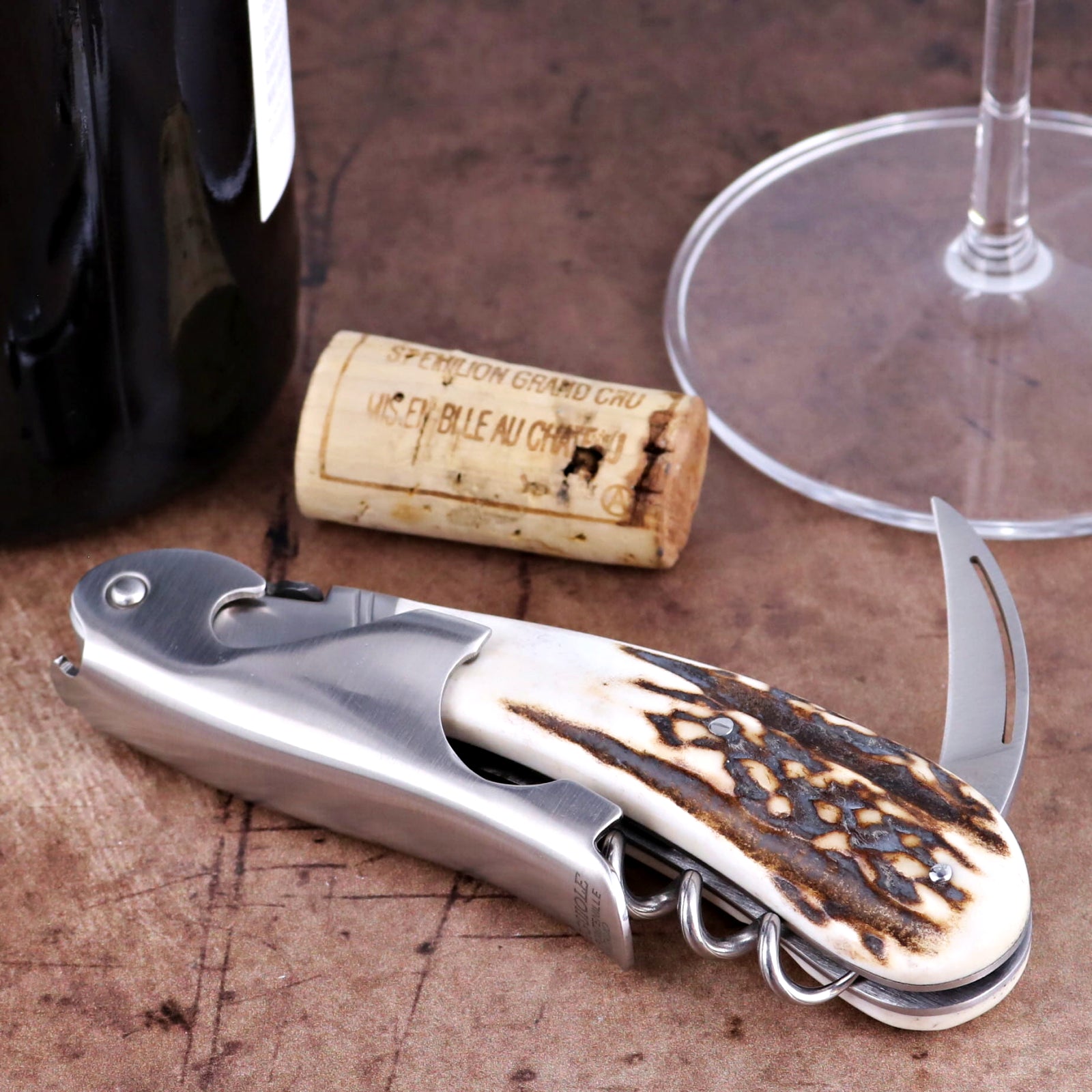 Laguiole Magnum Deer Stag Corkscrew, close-up of stainless steel tool with textured antler handle.
