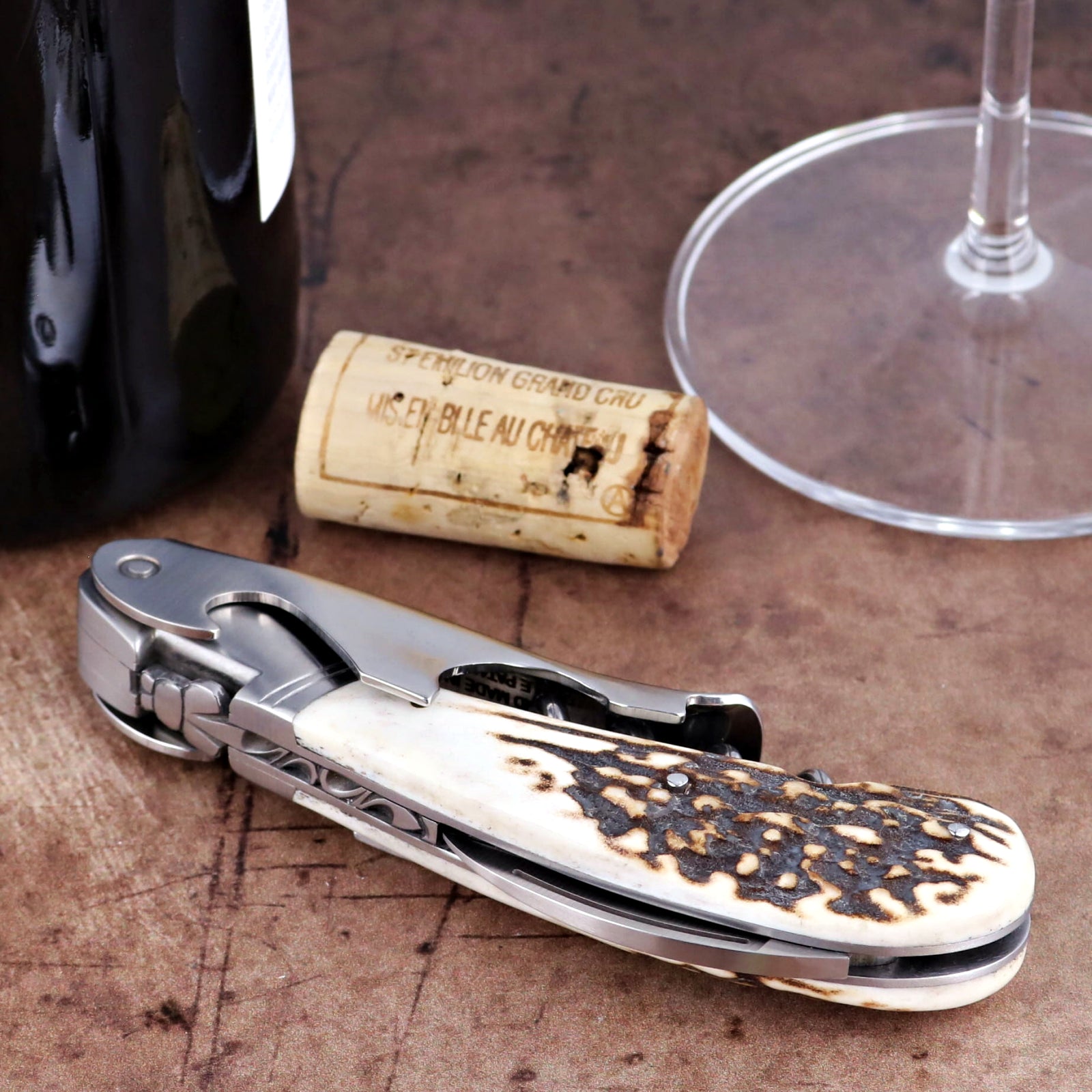 Laguiole Magnum Deer Stag Corkscrew, close-up of stainless steel tool with textured antler handle.