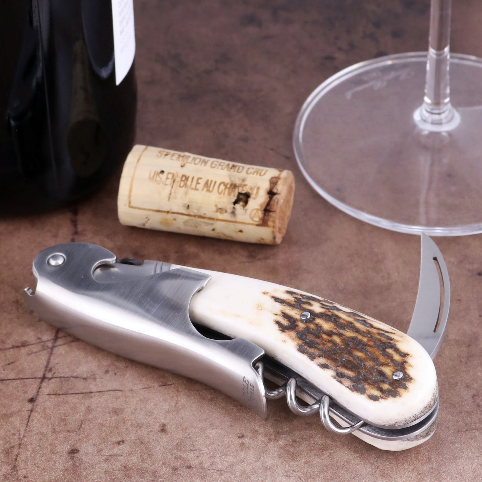 Laguiole Magnum Deer Stag Corkscrew close-up featuring a textured stag horn handle and steel body.