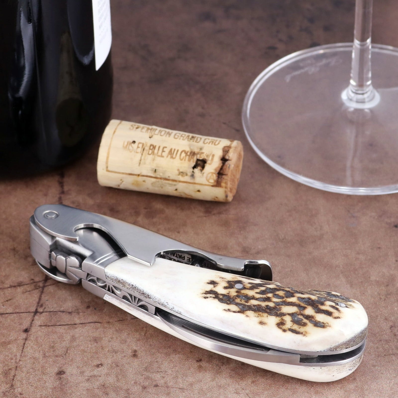 Laguiole Magnum Deer Stag Corkscrew close-up featuring a textured stag horn handle and steel body.