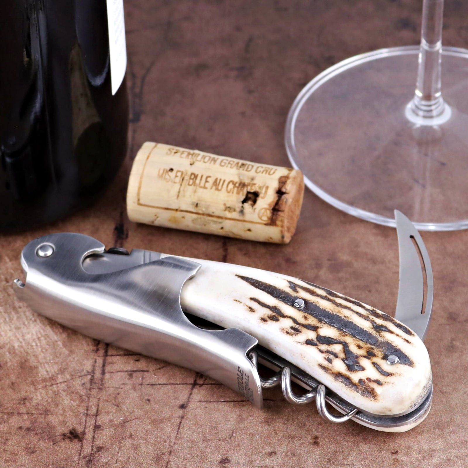Laguiole Magnum Deer Stag Corkscrew, close-up of stainless steel tool with textured antler handle.