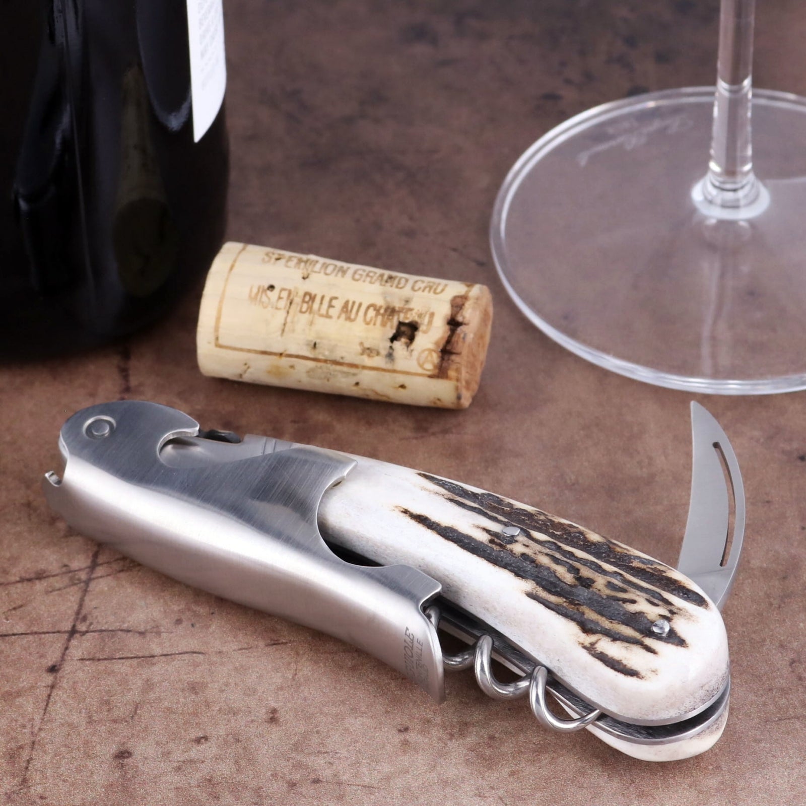 Laguiole Magnum Deer Stag Corkscrew, close-up of stainless steel tool with textured antler handle.