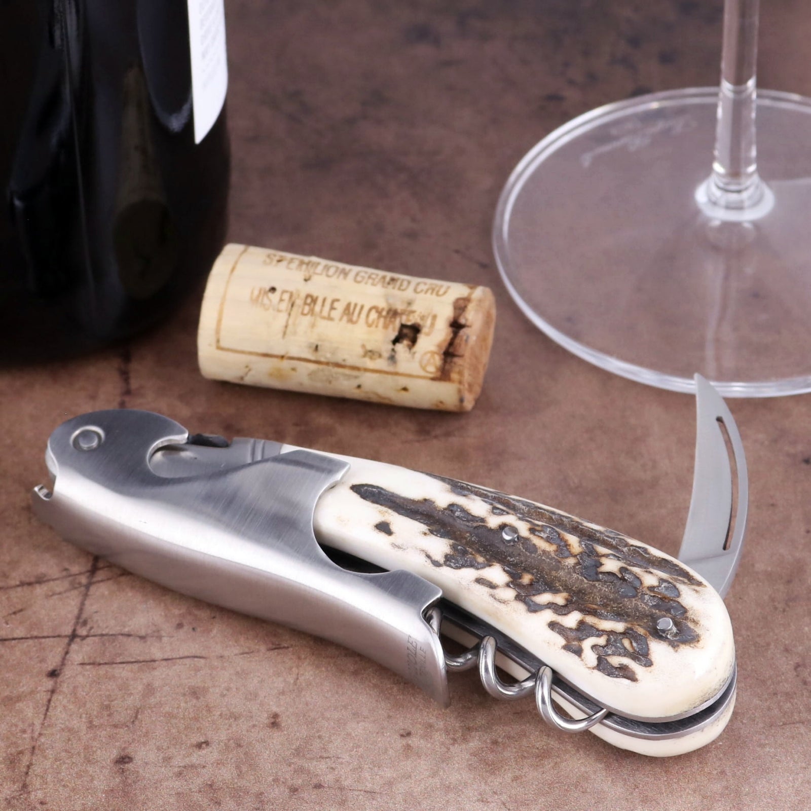 Laguiole Magnum Deer Stag Corkscrew, close-up of textured stag horn handle and stainless steel frame.