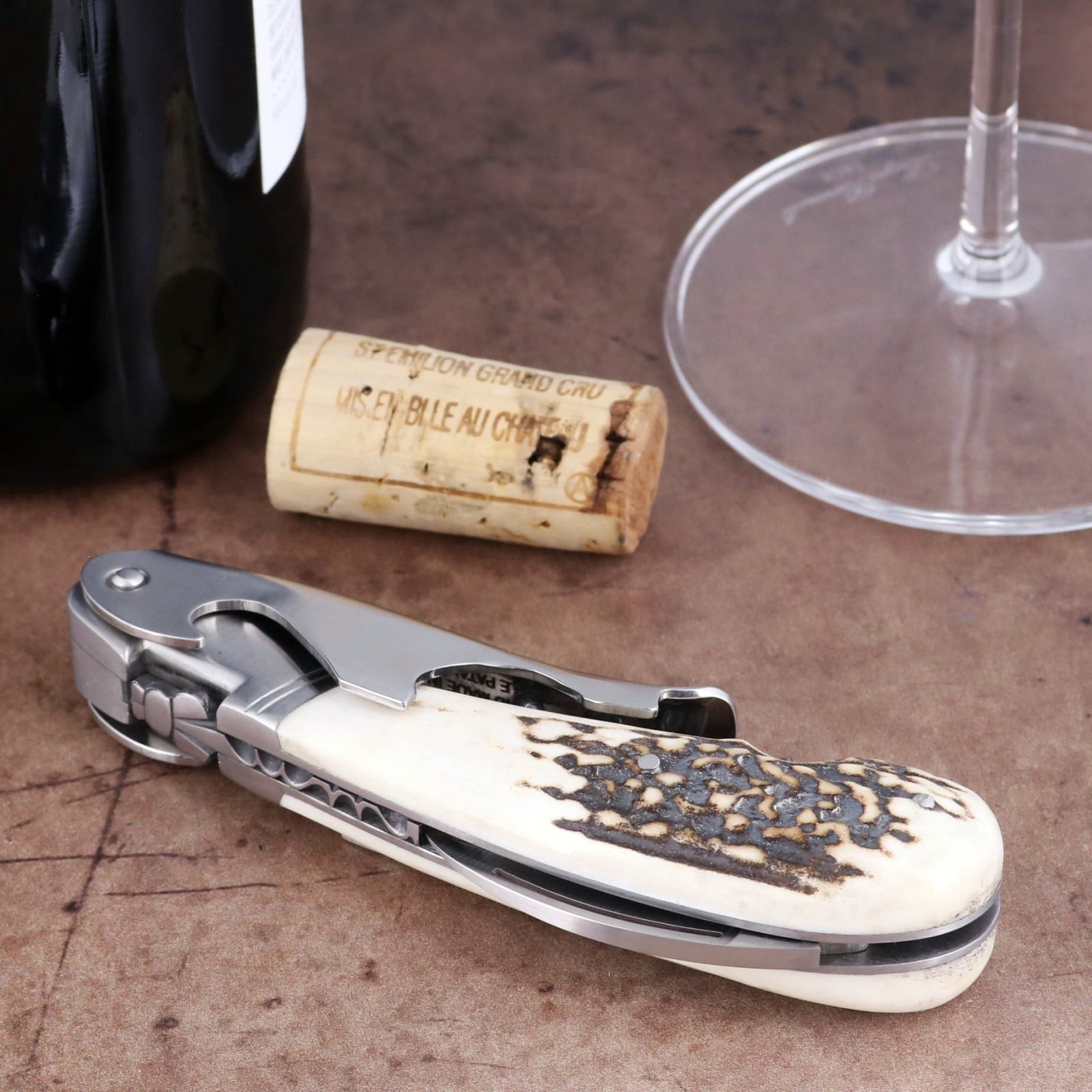 Laguiole Magnum Deer Stag Corkscrew, close-up of textured stag horn handle and stainless steel frame.