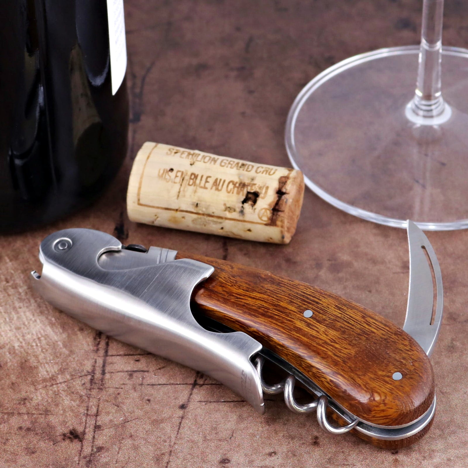 Laguiole Magnum Desert Ironwood Corkscrew close-up featuring polished steel and rich wood grain handle.