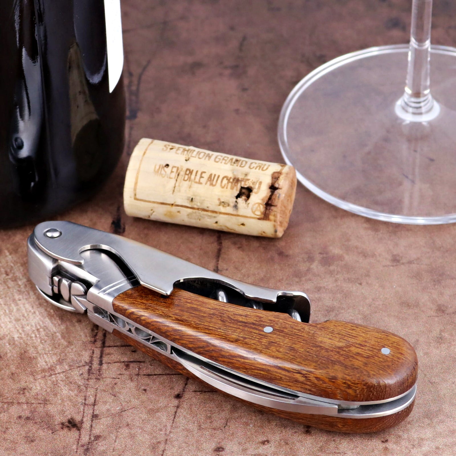 Laguiole Magnum Desert Ironwood Corkscrew close-up featuring polished steel and rich wood grain handle.