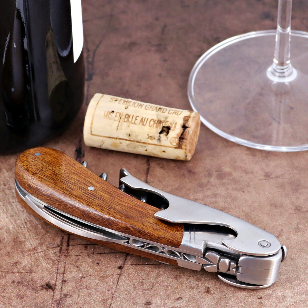 Laguiole Magnum Desert Ironwood corkscrew, close-up side view showing polished steel and wood grain.