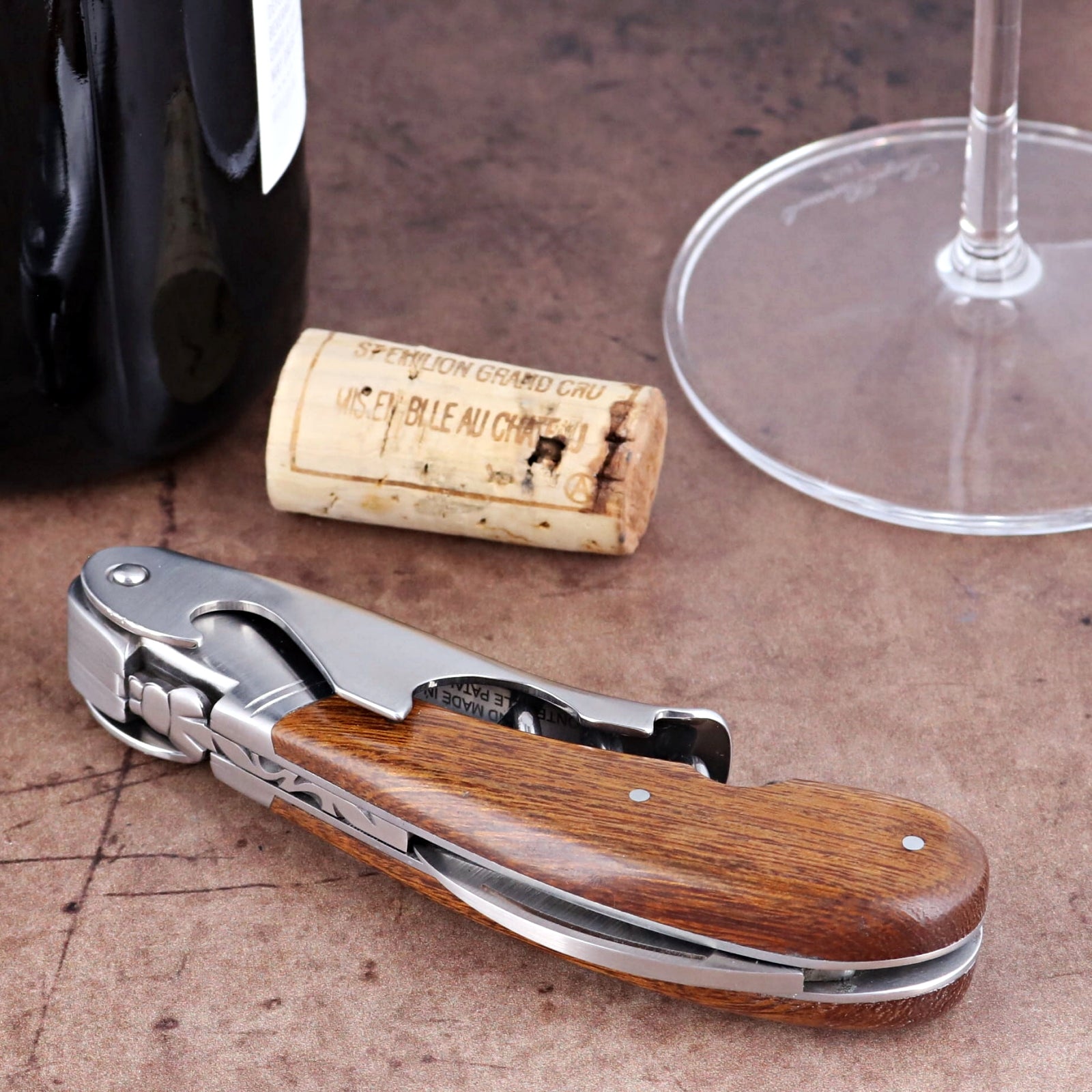 Laguiole Magnum Desert Ironwood Corkscrew, close-up side view showing wood handle and steel foil cutter.