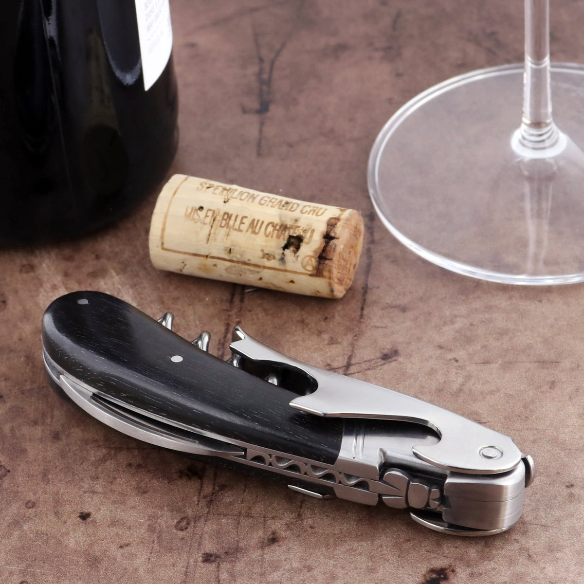 Laguiole Magnum Ebony Corkscrew, close-up of dark wood handle and polished steel tools.