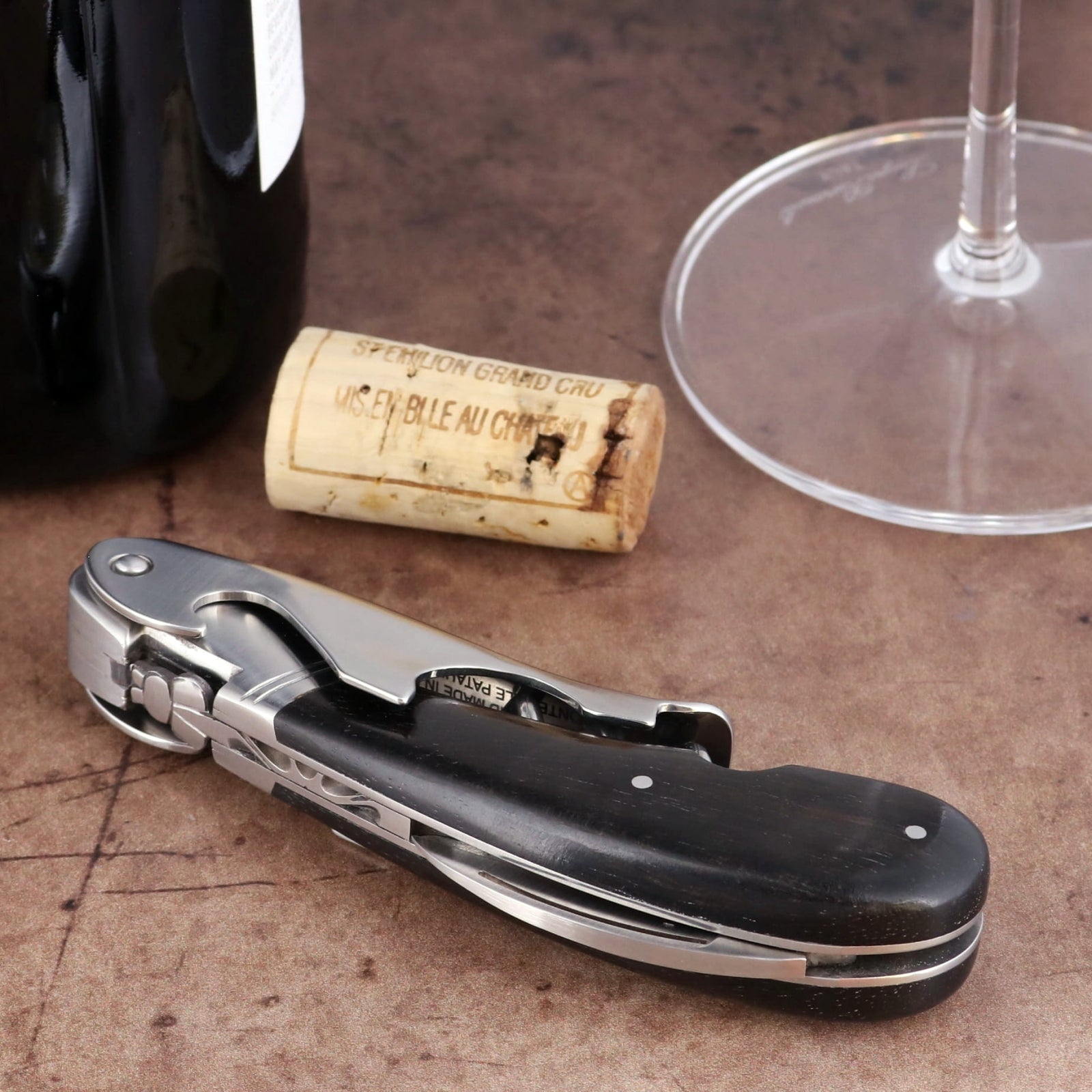 Laguiole Magnum Ebony Corkscrew, high-angle view featuring a polished steel bolster and black wood handle.
