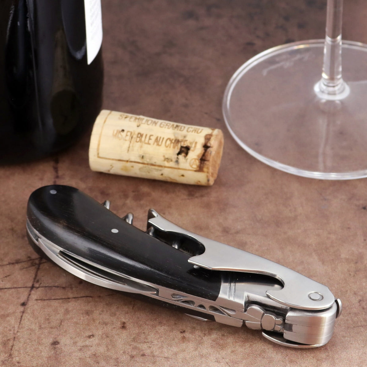 Laguiole Magnum Ebony Corkscrew, close-up side view showing polished ebony handle and steel mechanism.