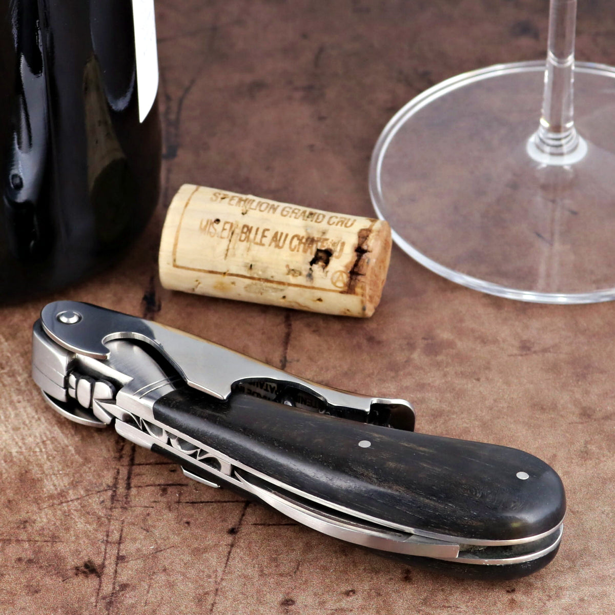 Laguiole Magnum Ebony Corkscrew close-up featuring a polished steel mechanism and dark wood handle.