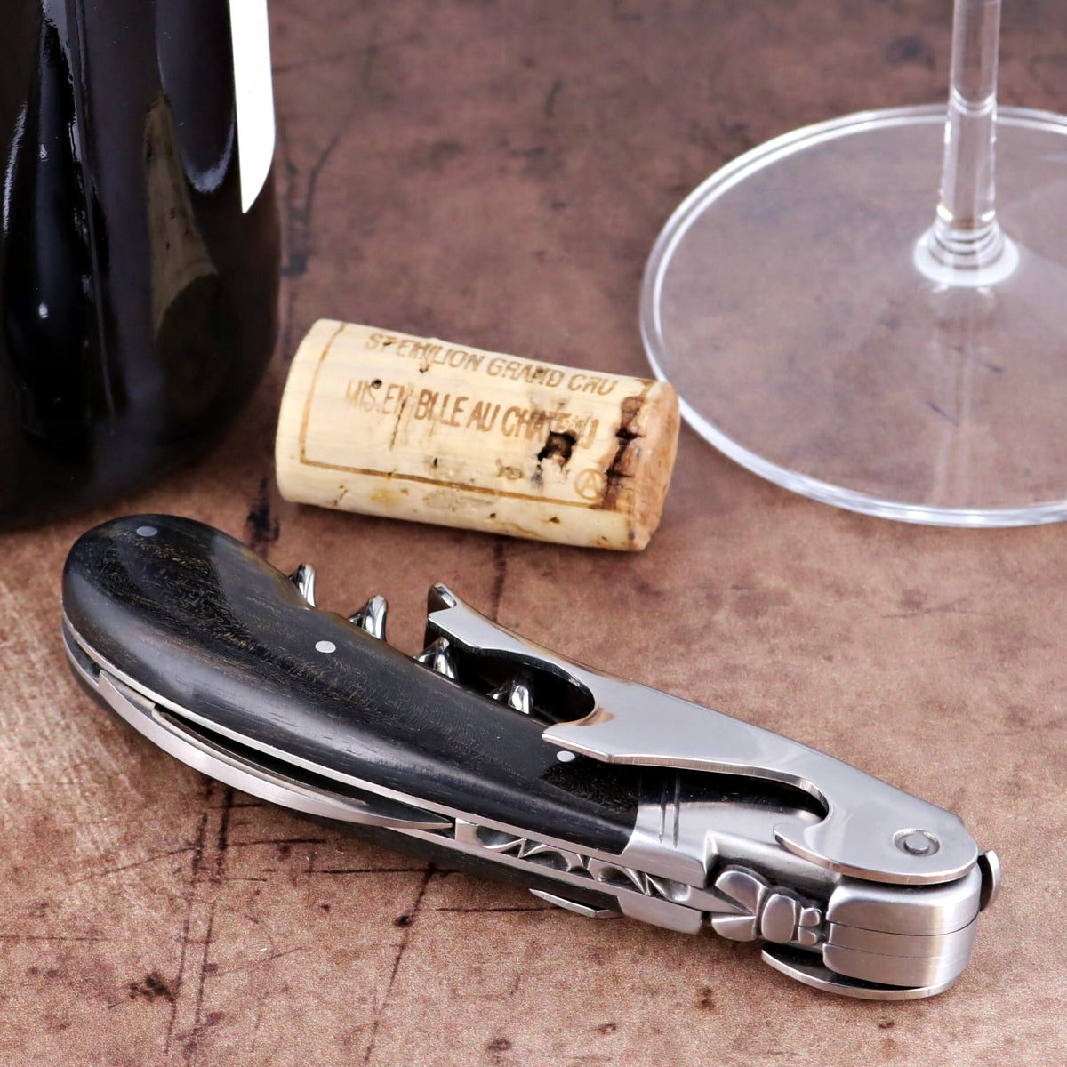 Laguiole Magnum Ebony Corkscrew, close-up of folded tool with polished steel and black ebony handle.