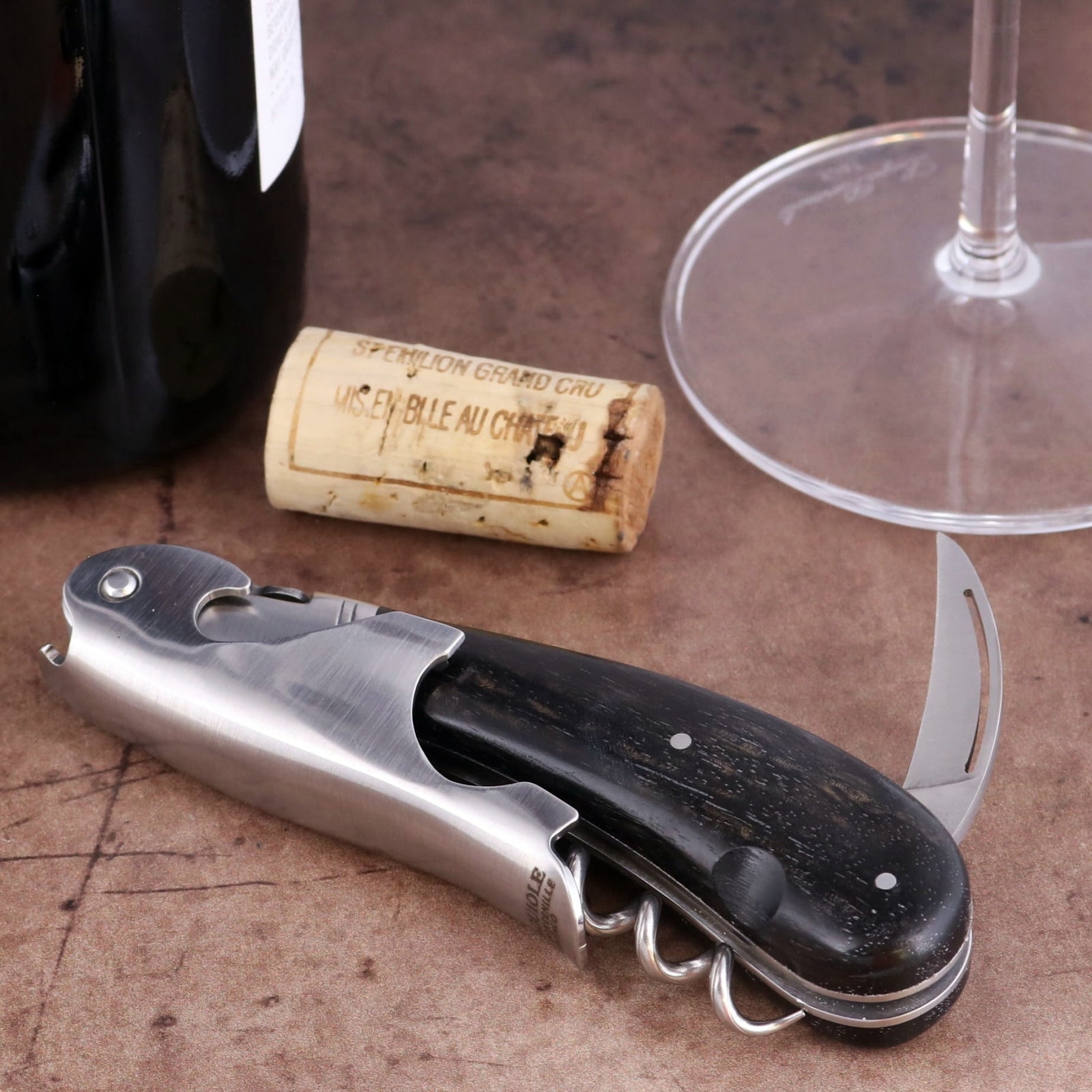 Laguiole Magnum Ebony Corkscrew, close-up side view showing black wood handle and steel foil cutter.