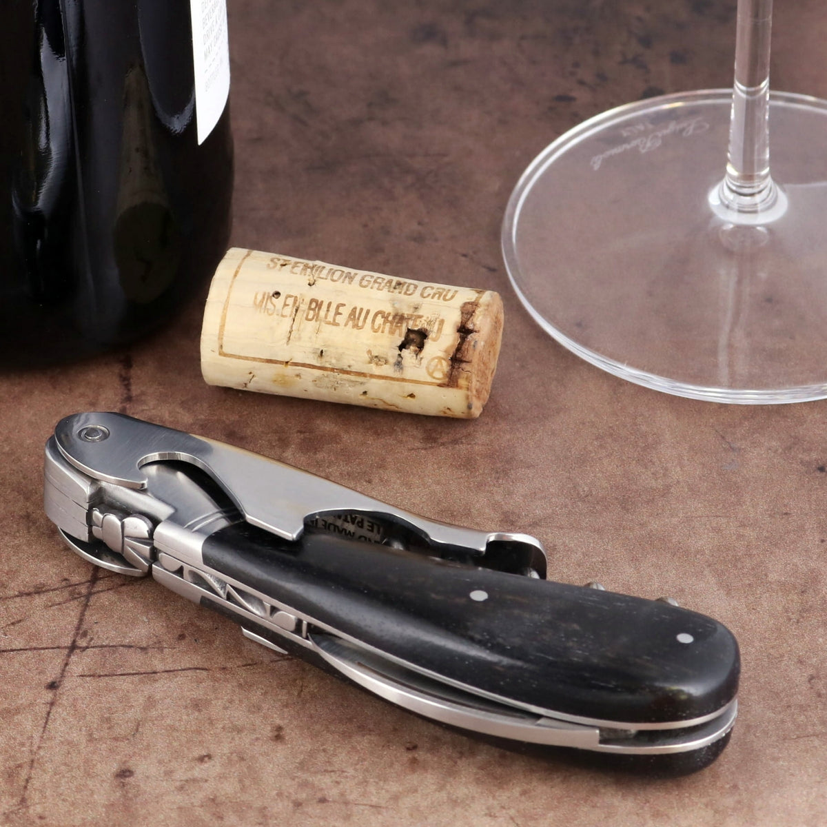 Laguiole Magnum Ebony Corkscrew, high-angle view of the folded black wood handle and steel mechanism.