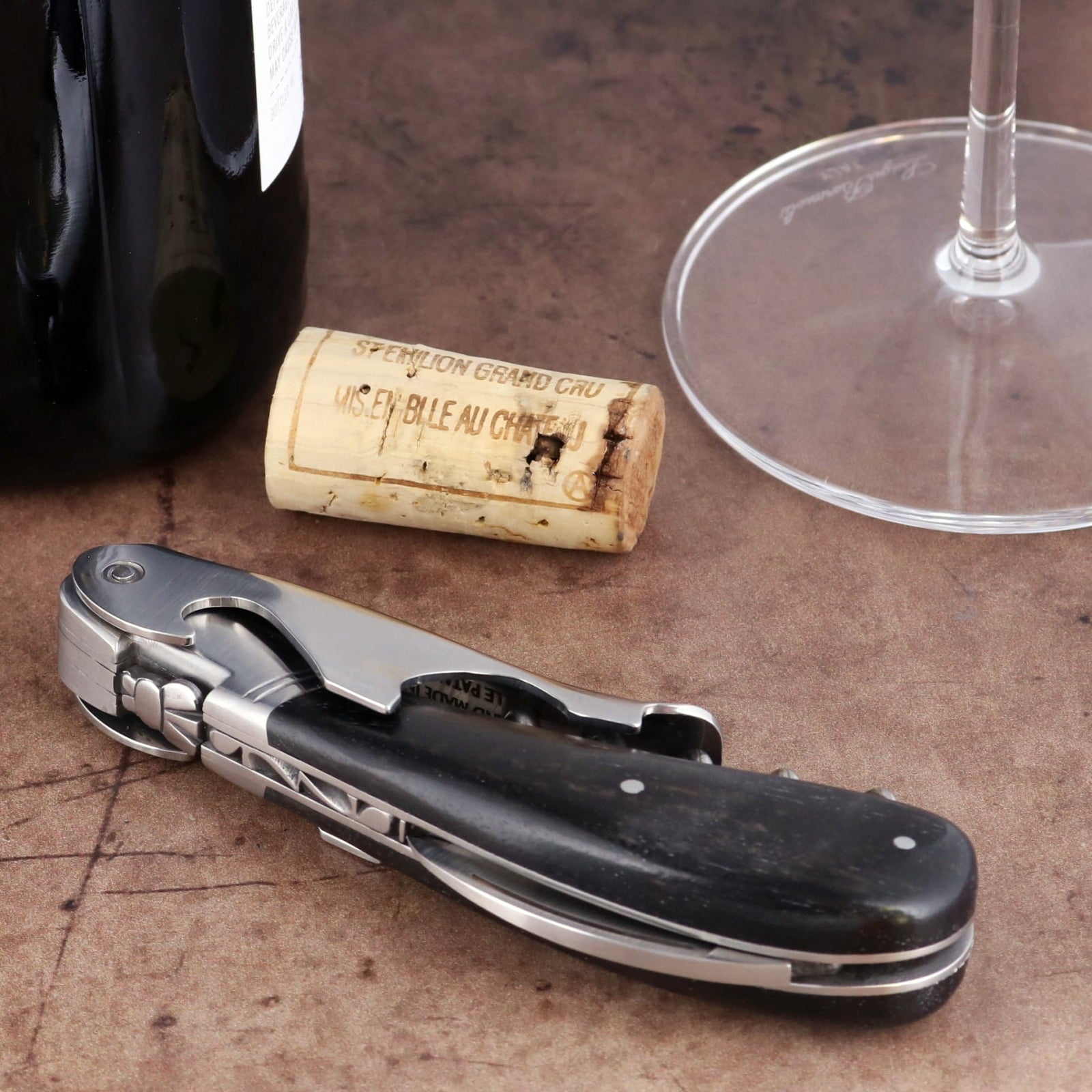 Laguiole Magnum Ebony Corkscrew, close-up side view showing black wood handle and steel foil cutter.