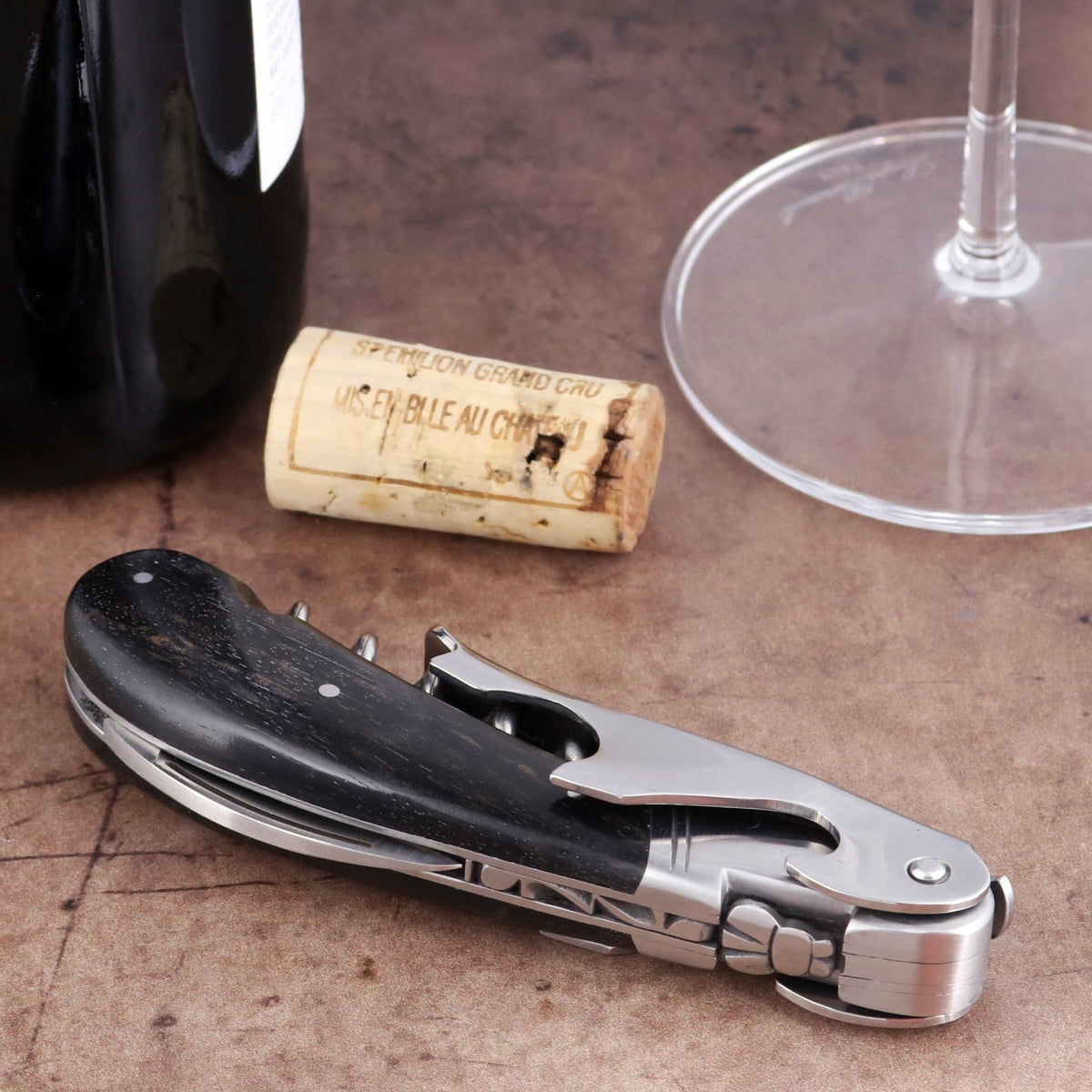Laguiole Magnum Ebony Corkscrew, close-up side view showing polished steel and dark wood handle.