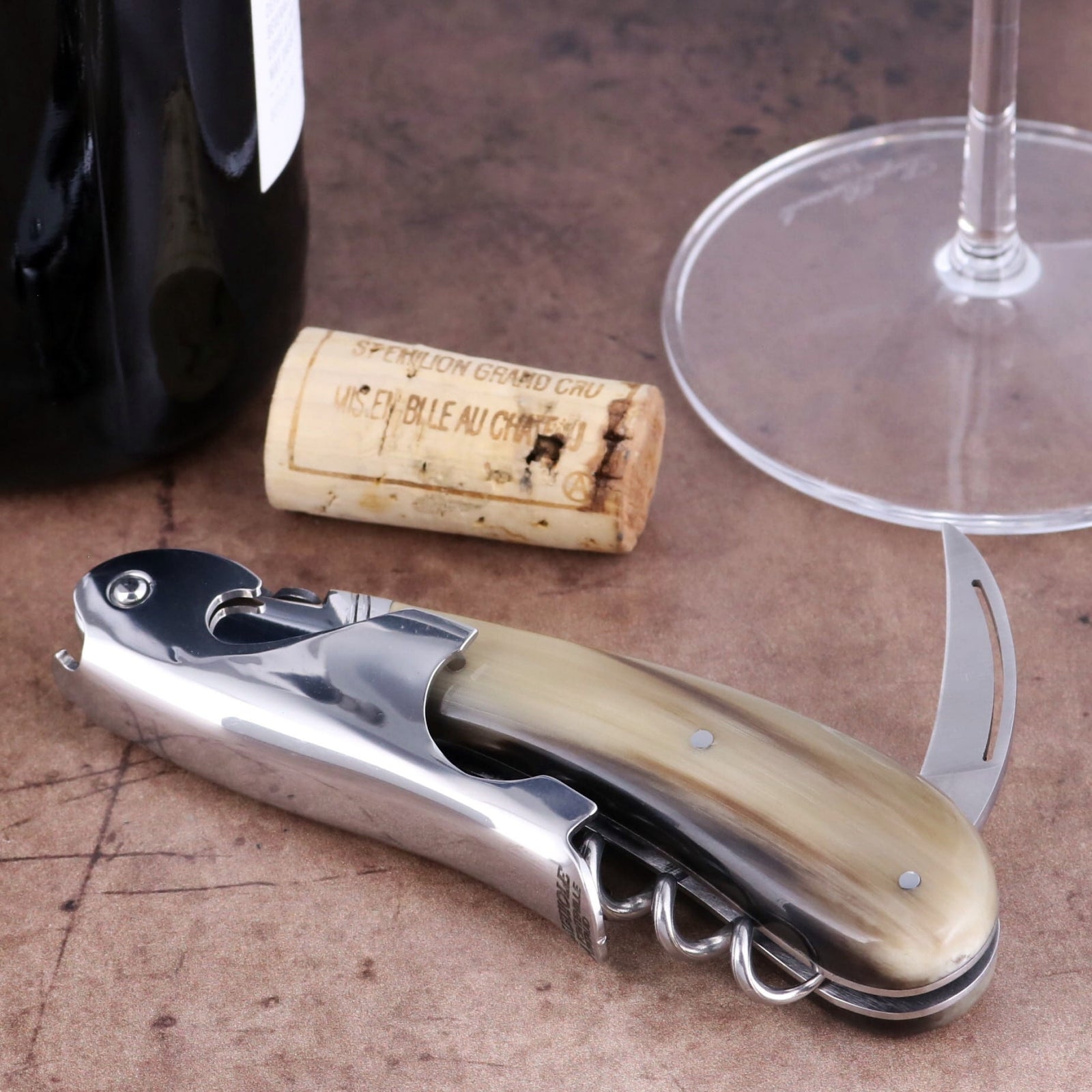 Laguiole Magnum Flamed Horn Tip Corkscrew close-up showing polished steel and natural horn handle.