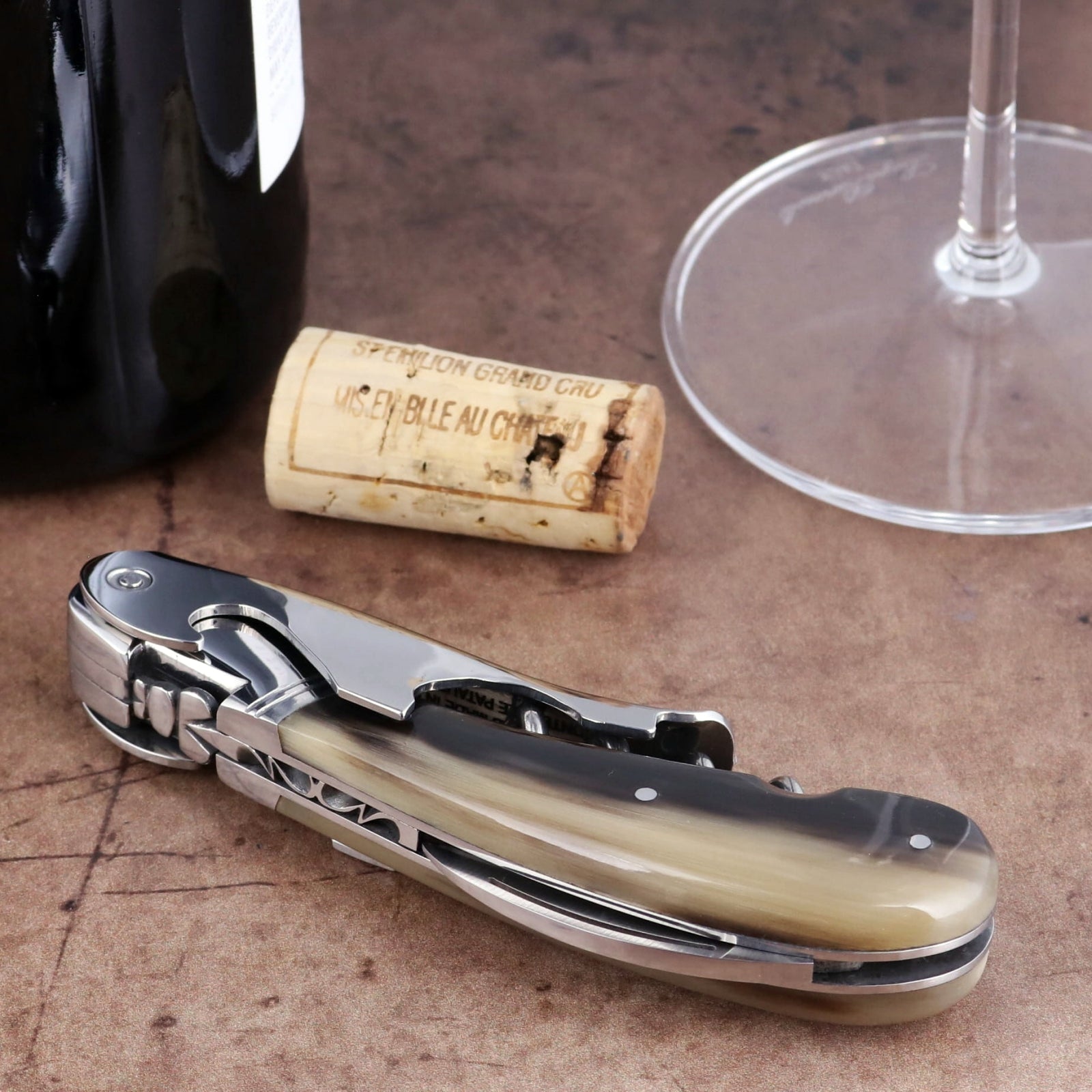 Laguiole Magnum Flamed Horn Tip Corkscrew close-up showing polished steel and natural horn handle.