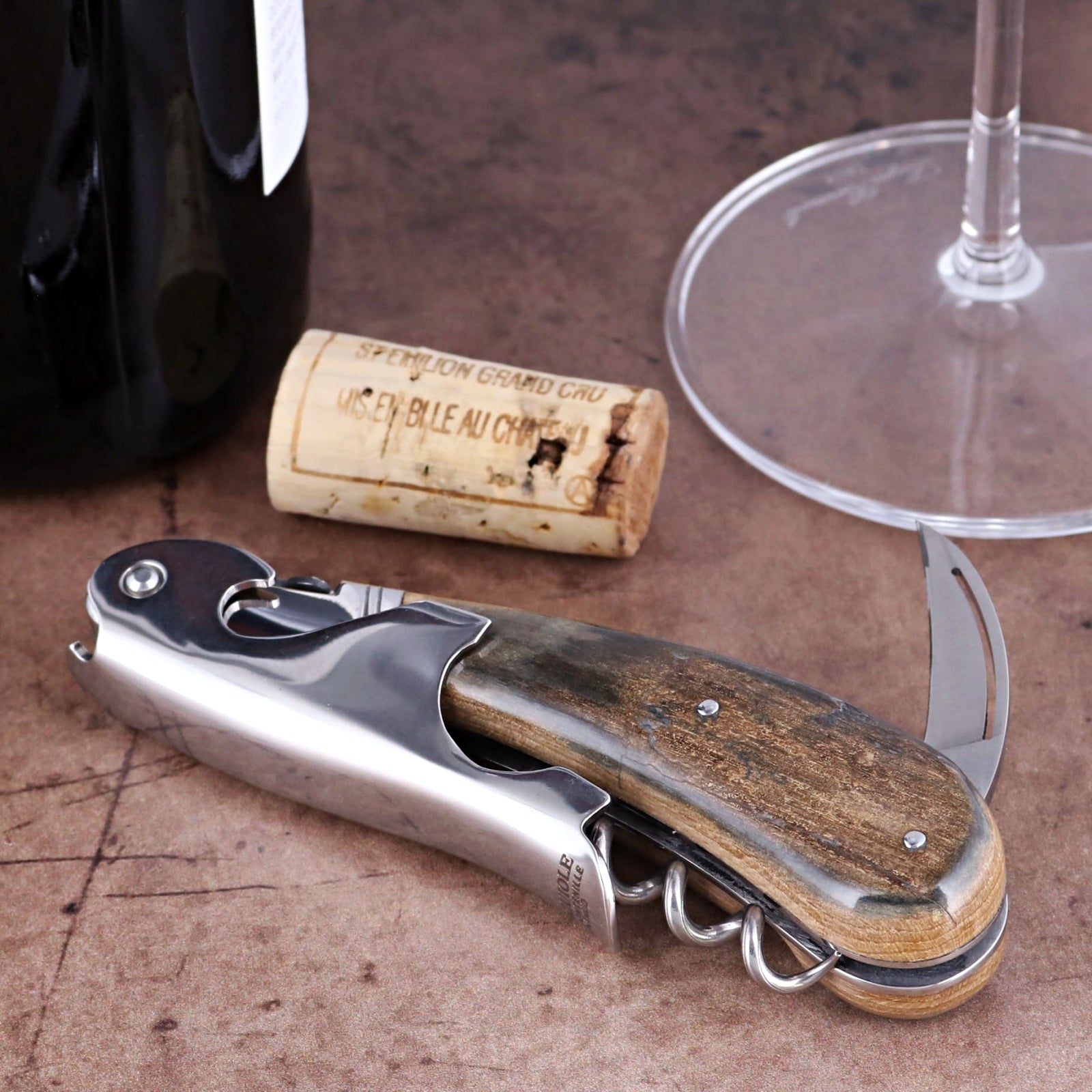 Laguiole Magnum Fossilized Mammoth Ivory Corkscrew, side view showing textured ivory handle and steel.