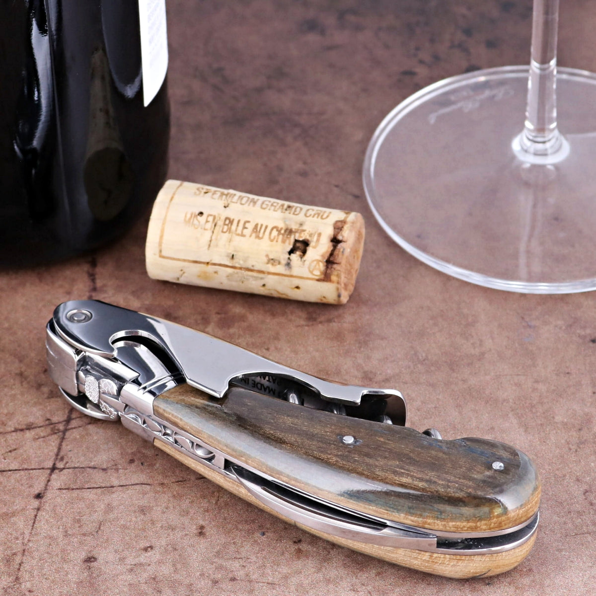 Laguiole Magnum Fossilized Mammoth Ivory Corkscrew, side view showing polished ivory and steel detail.