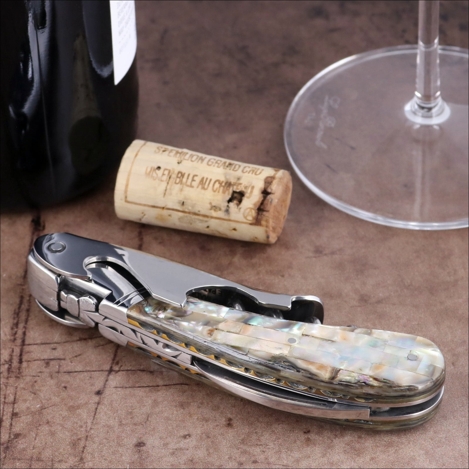 Laguiole Magnum Mother of Pearl Corkscrew, close-up of iridescent handle and polished steel finish.