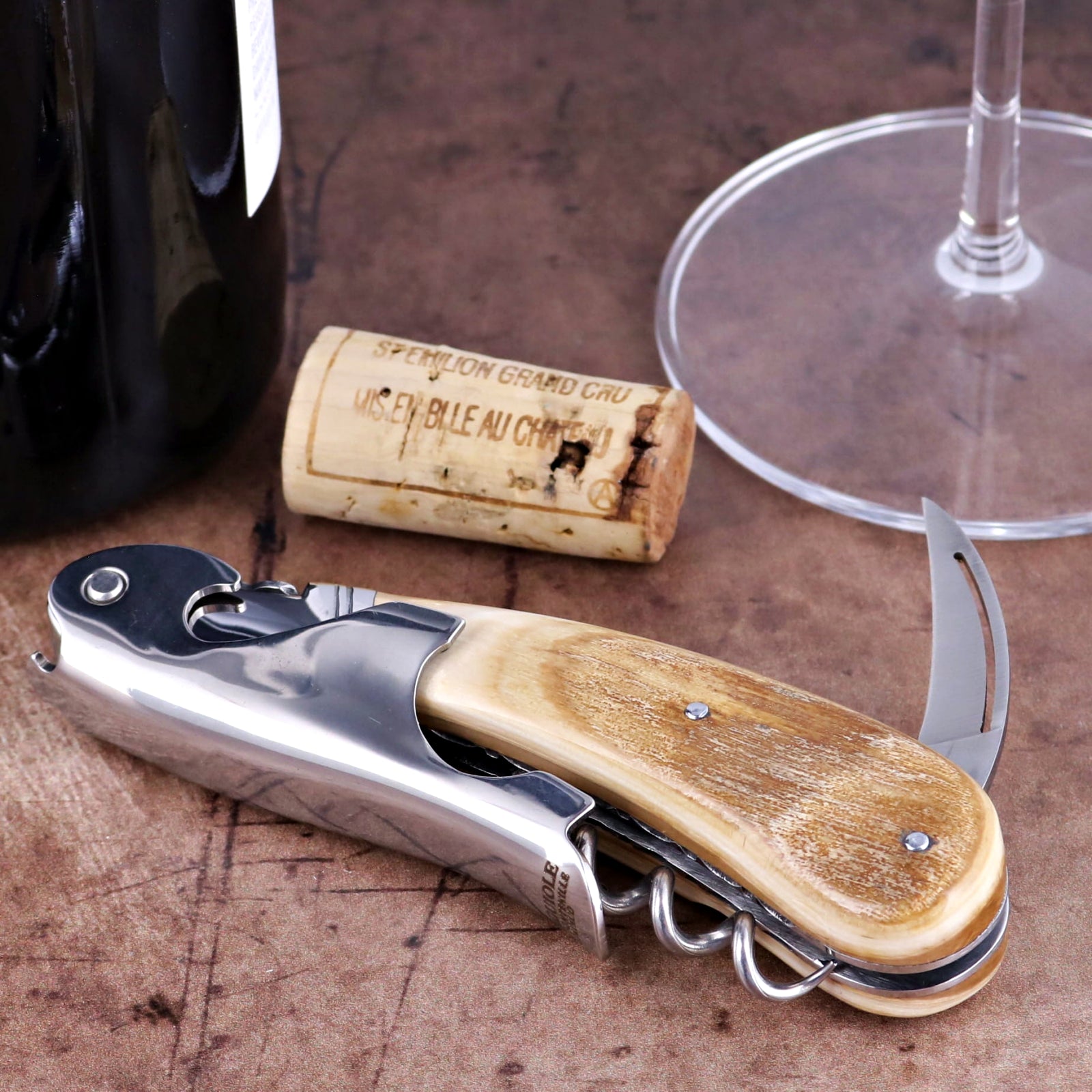 Laguiole Magnum Guilloche Fossilized Mammoth Ivory Corkscrew, side view showing cream ivory handle.