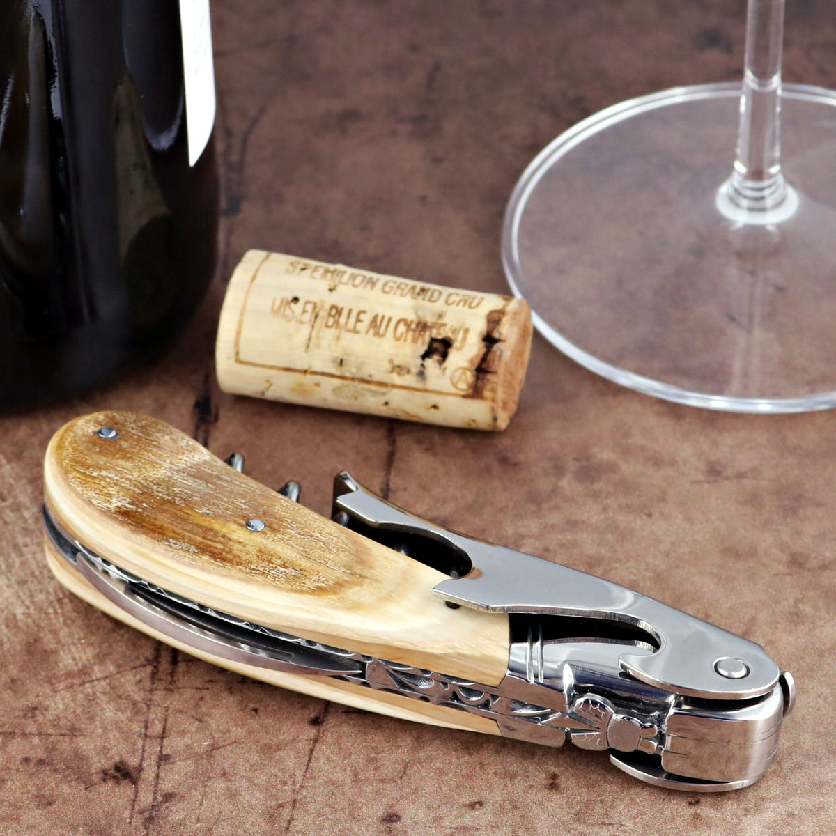 Laguiole Magnum Guilloche Fossilized Mammoth Ivory Corkscrew: side view of ivory handle and steel.