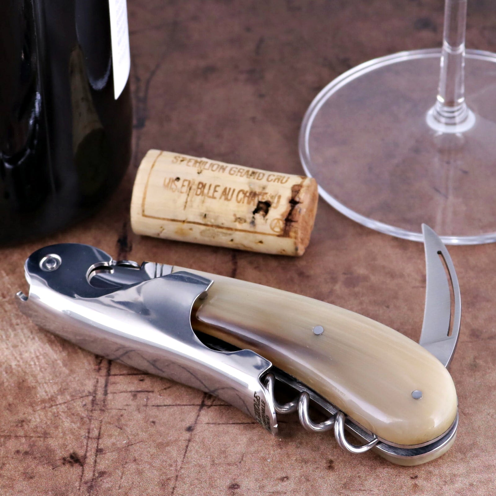 Laguiole Magnum Horn Tip Corkscrew close-up featuring a polished steel body and smooth horn handle.