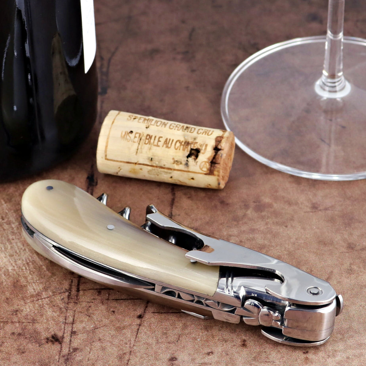 Laguiole Magnum Horn Tip Corkscrew, close-up of polished horn handle and stainless steel mechanism.