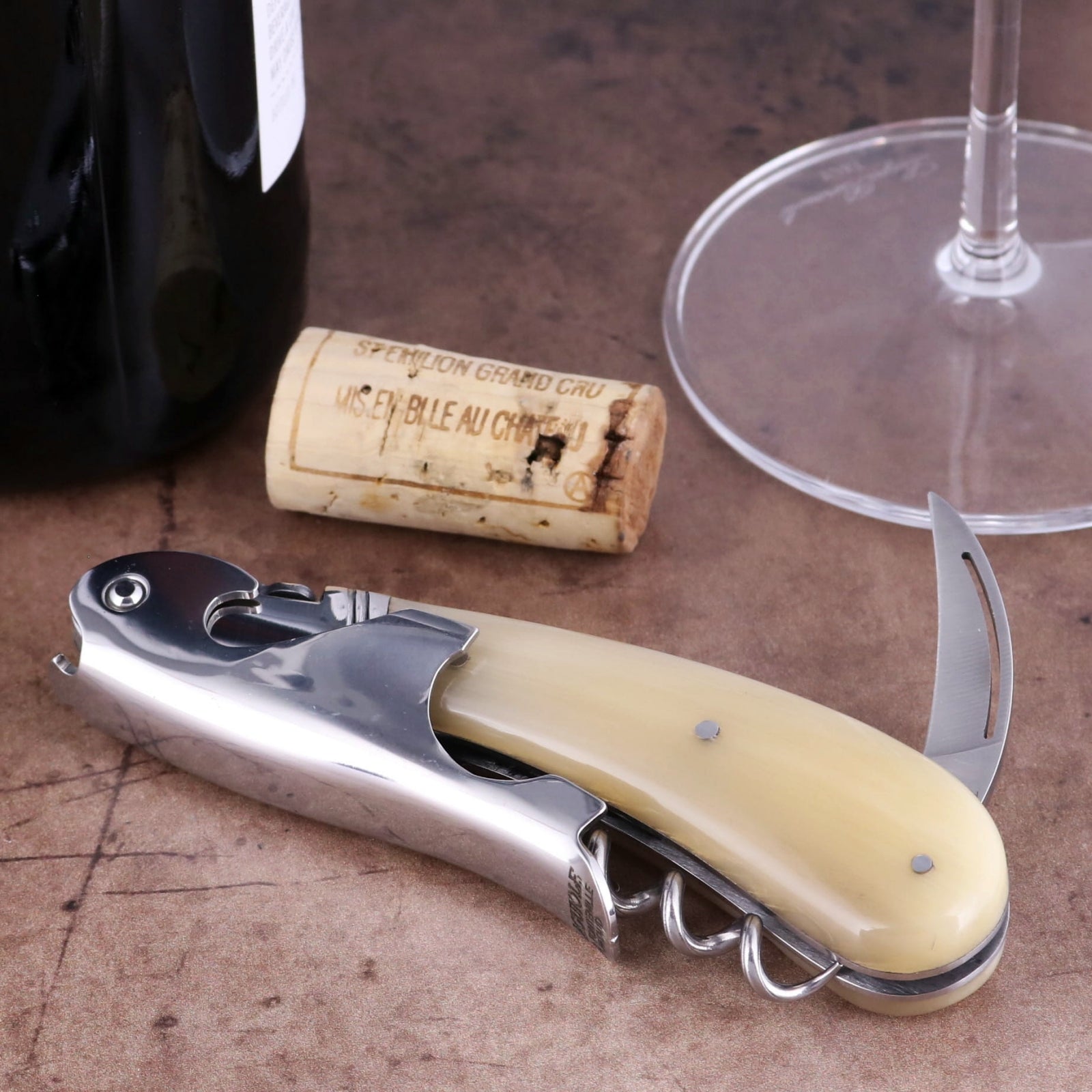 Laguiole Magnum Horn Tip Corkscrew, close-up of polished steel and cream horn handle with foil cutter.