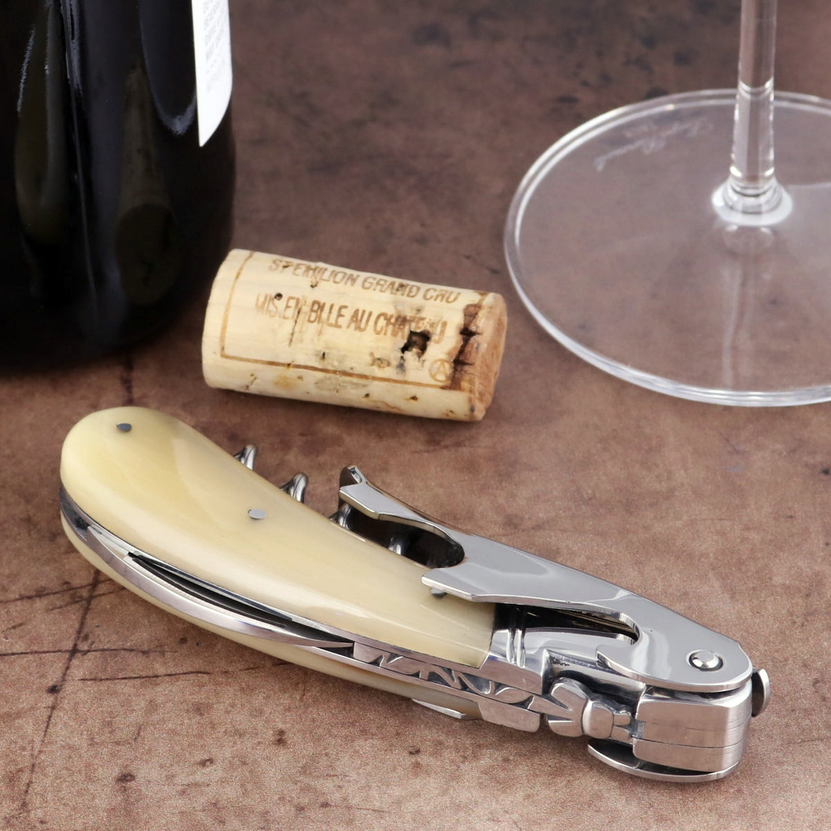 Laguiole Magnum Horn Tip Corkscrew, close-up side view of cream horn handle and polished steel tool.