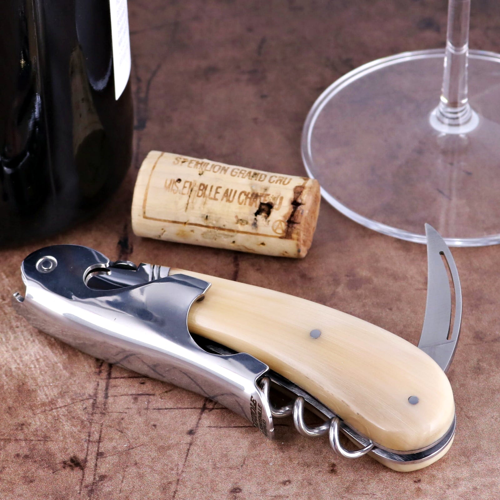 Laguiole Magnum Horn Tip Corkscrew, close-up of polished steel and cream horn handle with foil cutter.