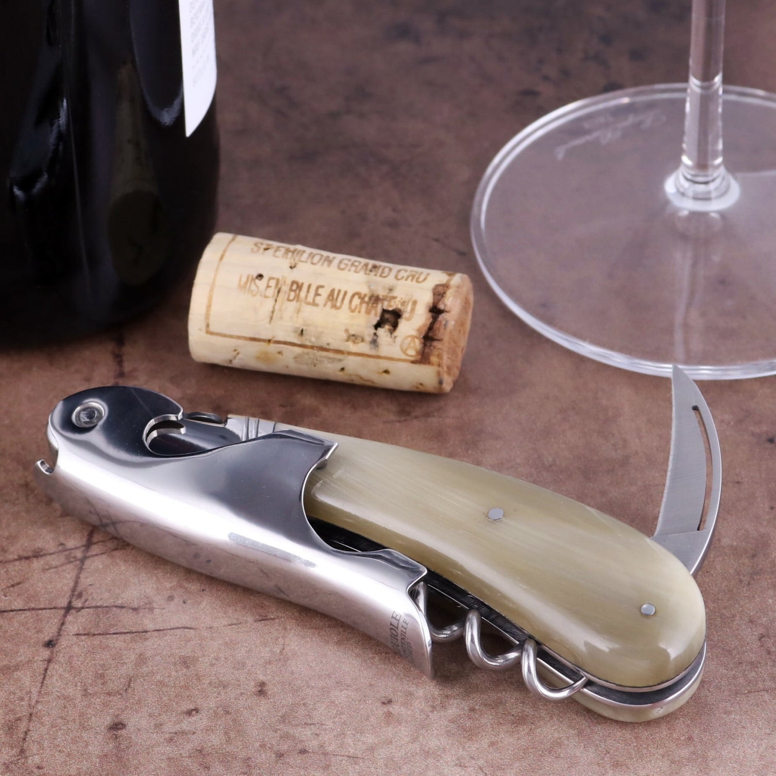 Laguiole Magnum Horn Tip Corkscrew close-up featuring a polished steel body and smooth horn handle.