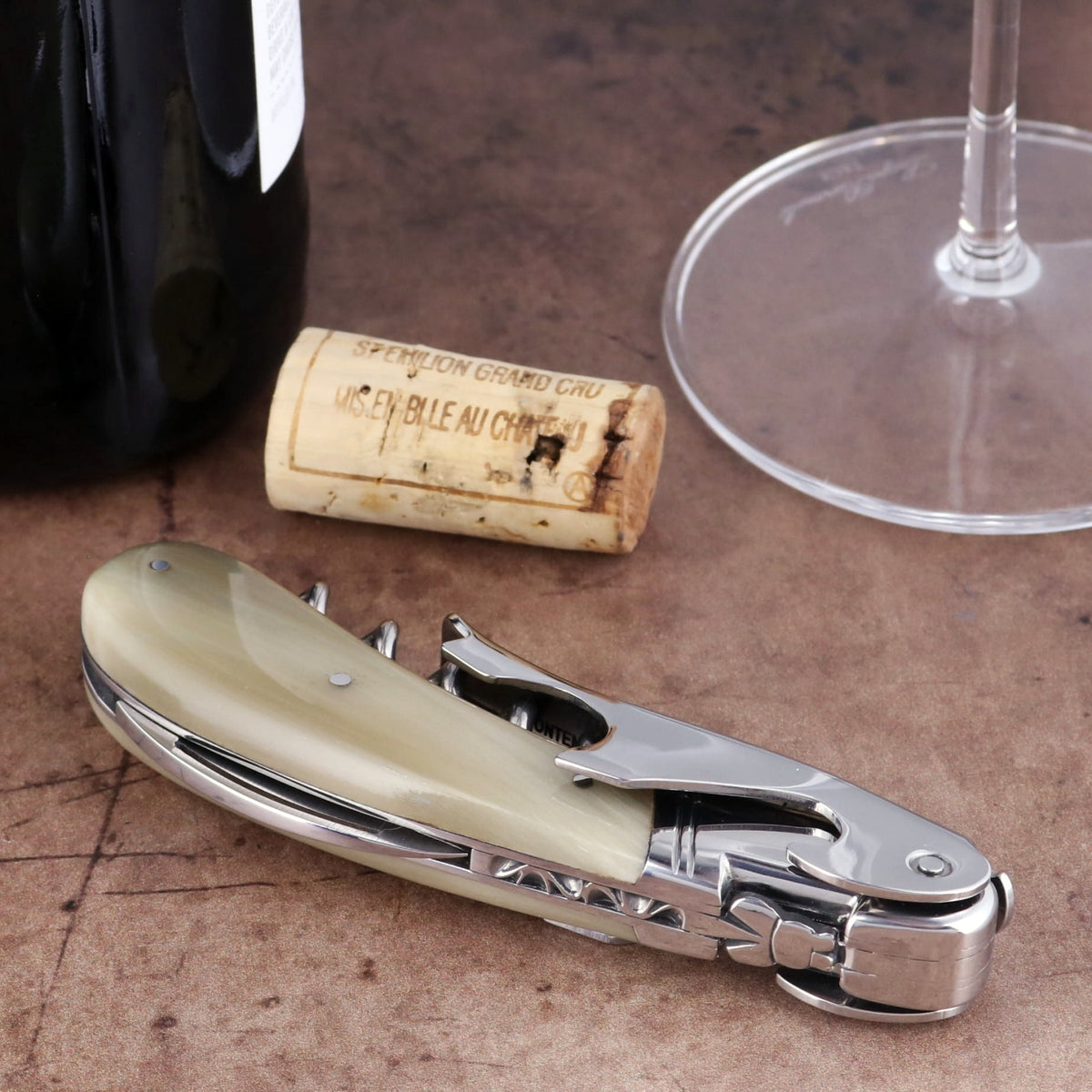 Laguiole Magnum Horn Tip Corkscrew, close-up side view of polished horn handle and steel mechanism.