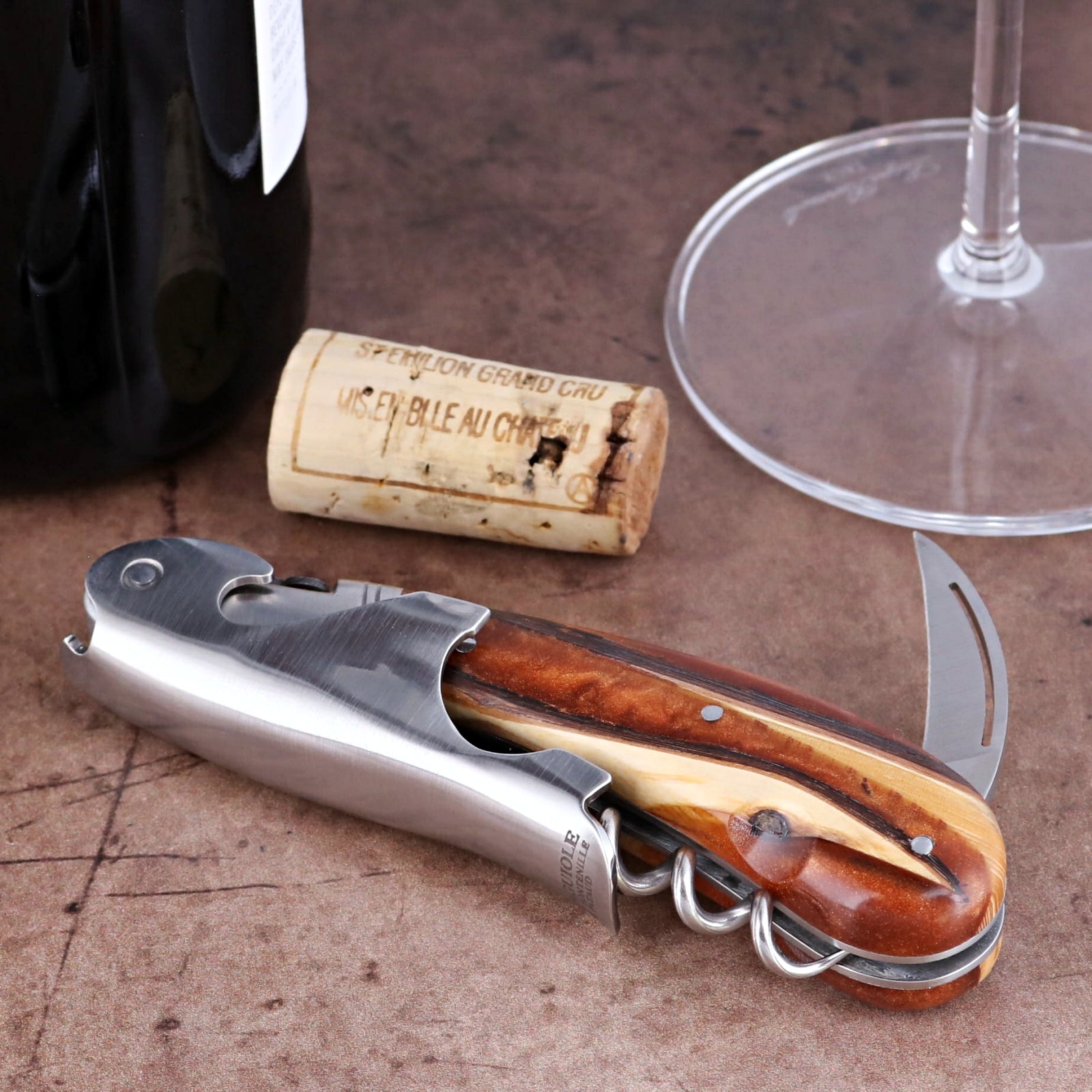 Laguiole Magnum Hybrid Juniper Burl corkscrew, close-up side view showing wood handle and steel frame.