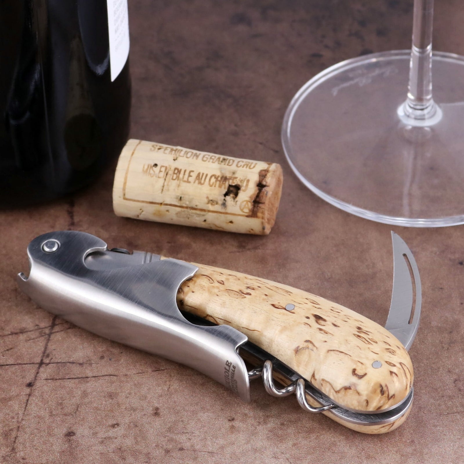 Laguiole Magnum Karelian Birch Corkscrew, close-up side view showing polished steel and wood handle.