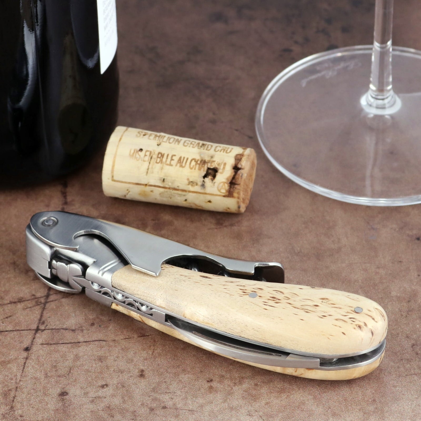 Laguiole Magnum Karelian Birch Corkscrew, close-up side view showing polished steel and wood handle.