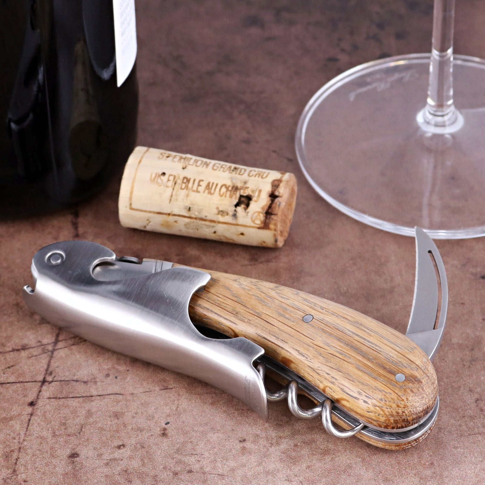 Laguiole Magnum Oak Barrel Wood Corkscrew, close-up of stainless steel and rustic oak wood handle.