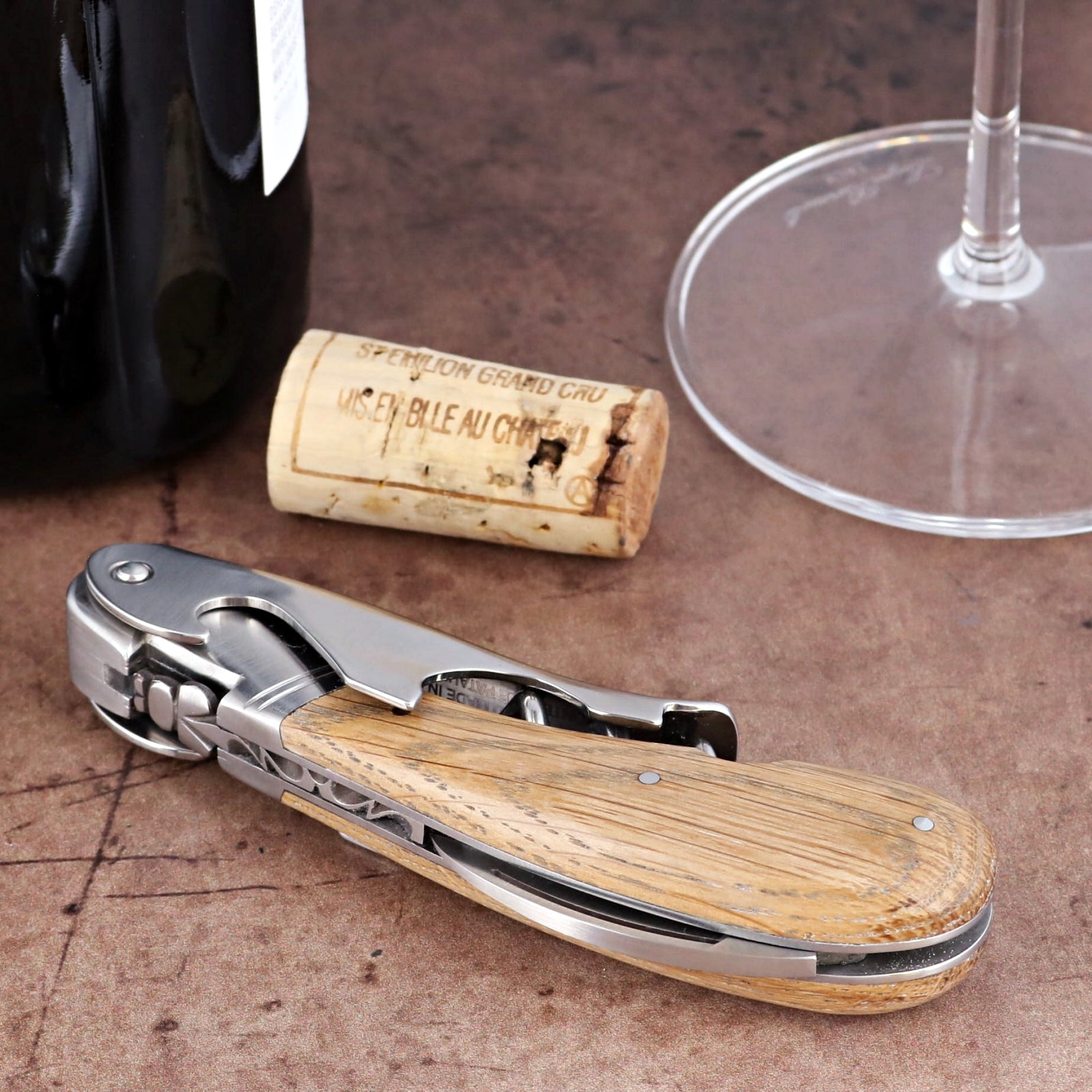 Laguiole Magnum Oak Barrel Wood Corkscrew, close-up of stainless steel and rustic oak wood handle.