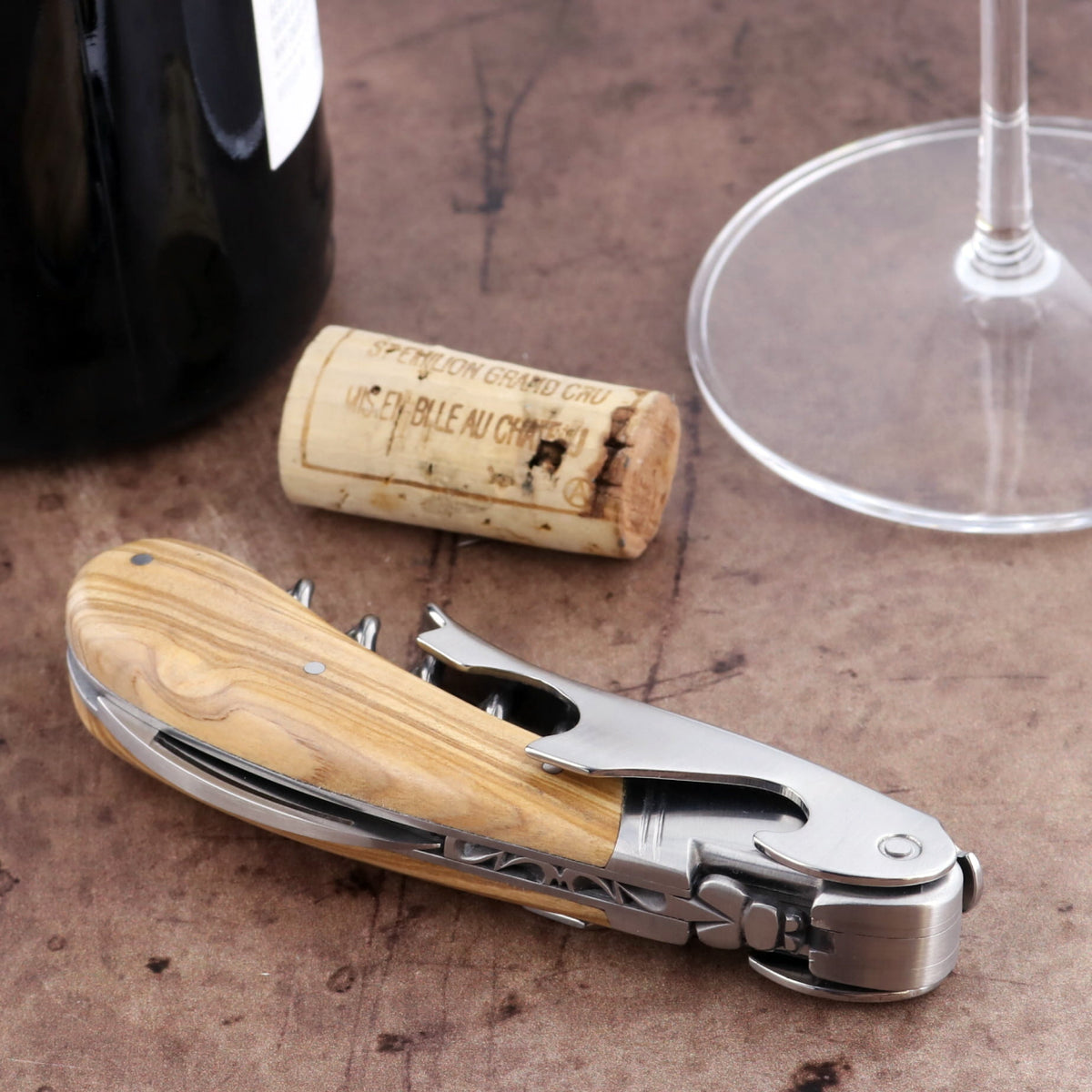 Laguiole Magnum Olive Wood Corkscrew, close-up of the olive wood handle and stainless steel mechanism.