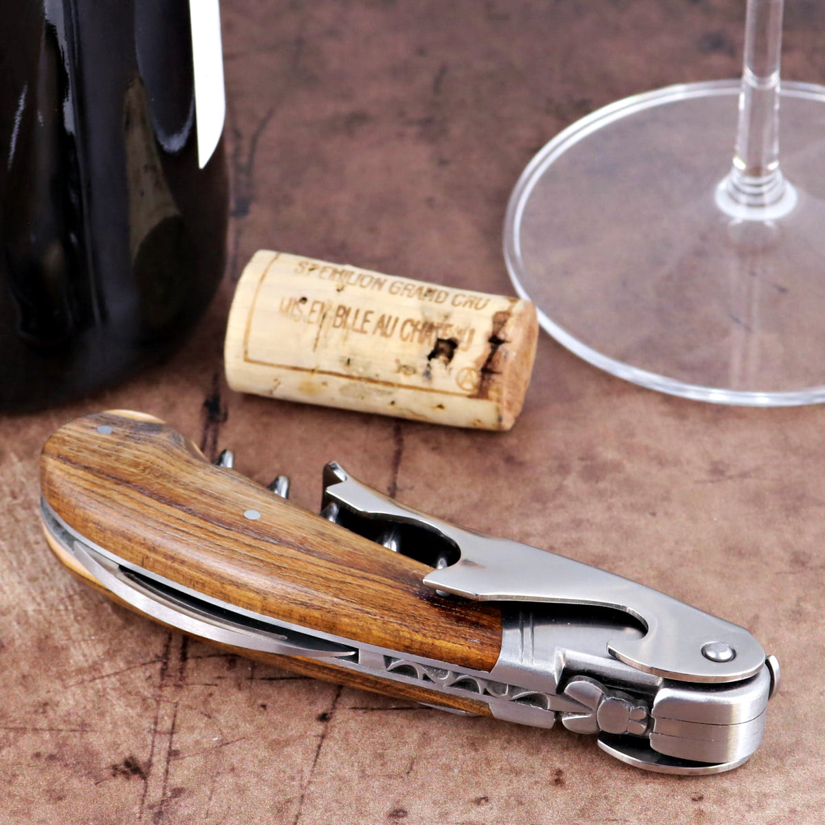 Laguiole Magnum Pistachio corkscrew, close-up side view of polished steel and wood handle.