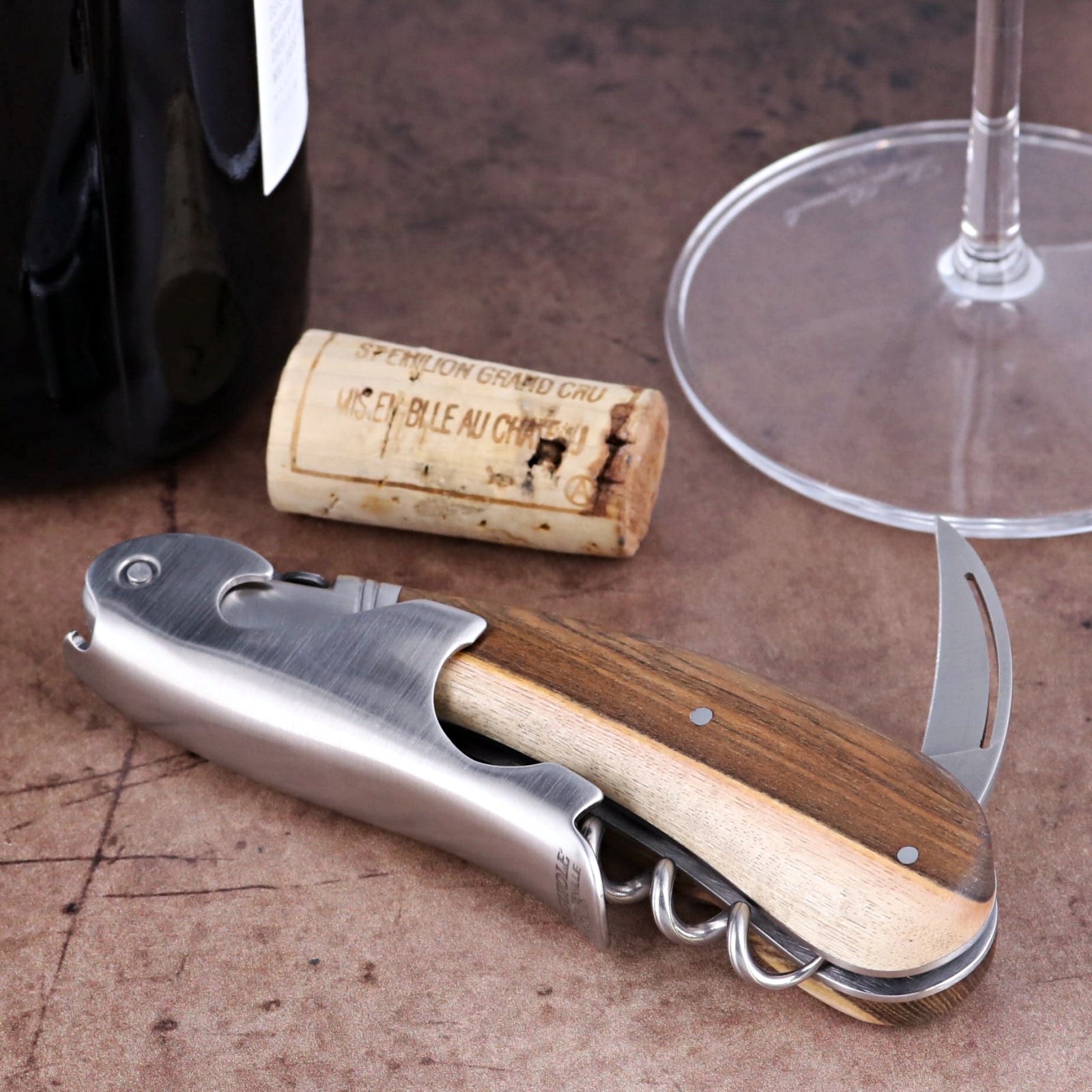 Laguiole Magnum Pistachio Corkscrew close-up featuring a polished steel body and natural wood handle.