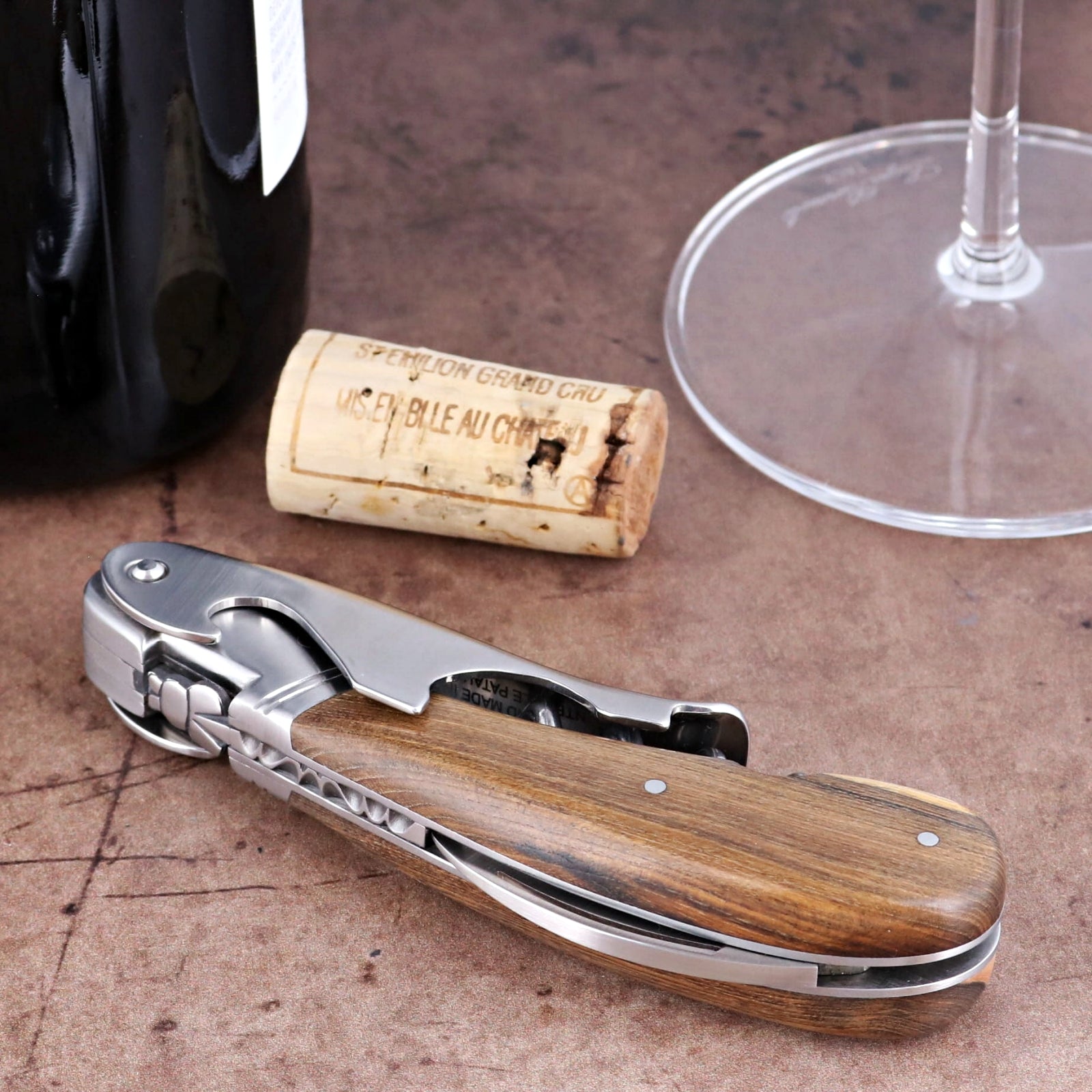 Laguiole Magnum Pistachio Corkscrew close-up featuring a polished steel body and natural wood handle.