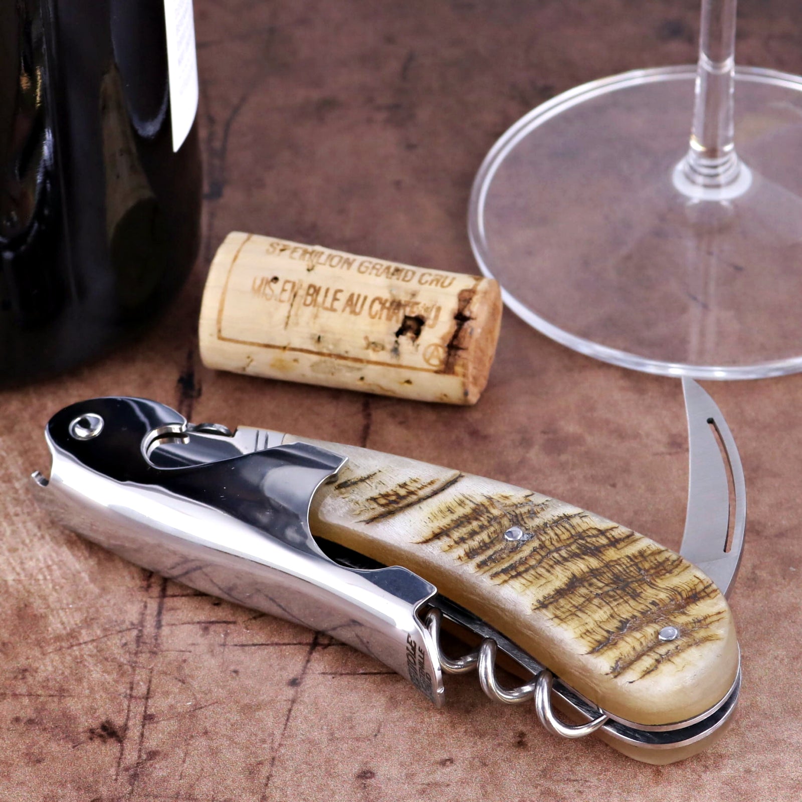 Laguiole Magnum Ram Horn Corkscrew close-up featuring a polished steel body and textured horn handle.