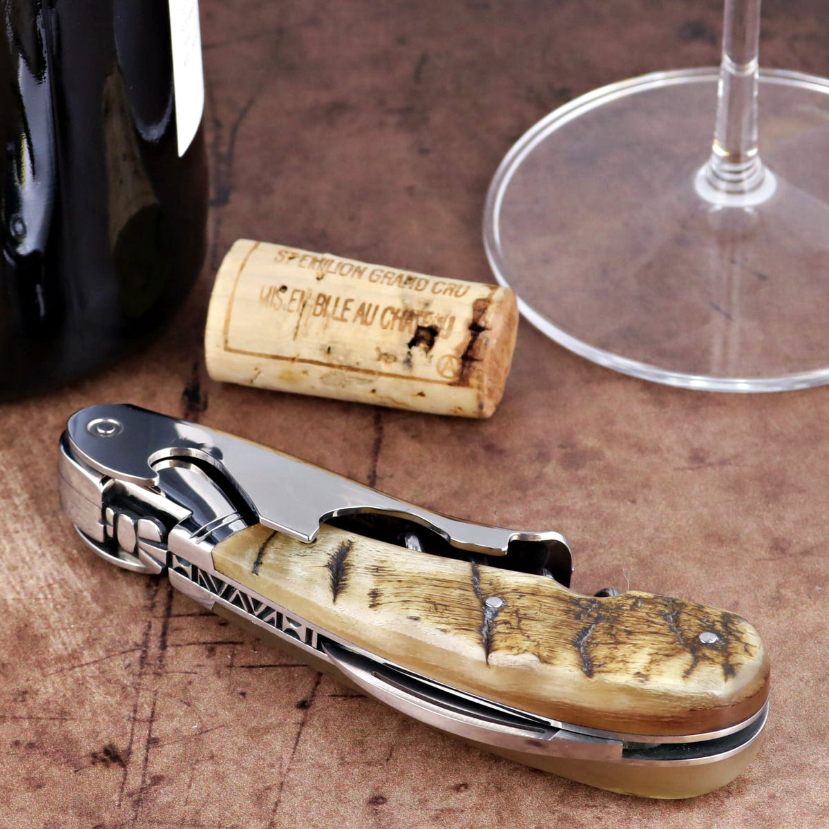Laguiole Magnum Ram Horn Corkscrew, close-up side view showing textured horn handle and steel frame.