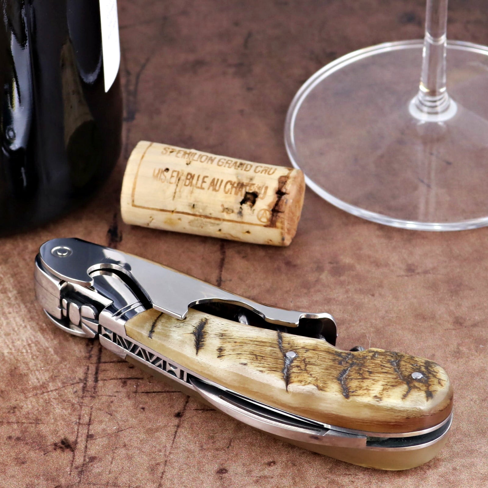 Laguiole Magnum Ram Horn Corkscrew, close-up of polished steel and textured cream horn handle.